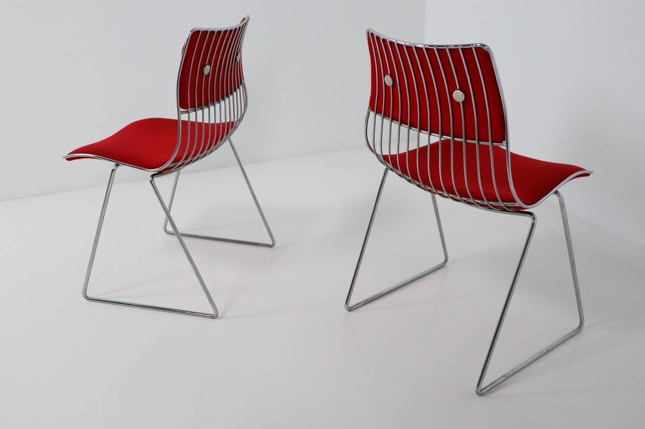A set of eight 1970 Rudi Verelst dinging chairs for Novalux. The frames are in very good condition. The beautiful original red fabric is worn in places and does show signs of use commensurate with its age and past use. You may want to replace the
