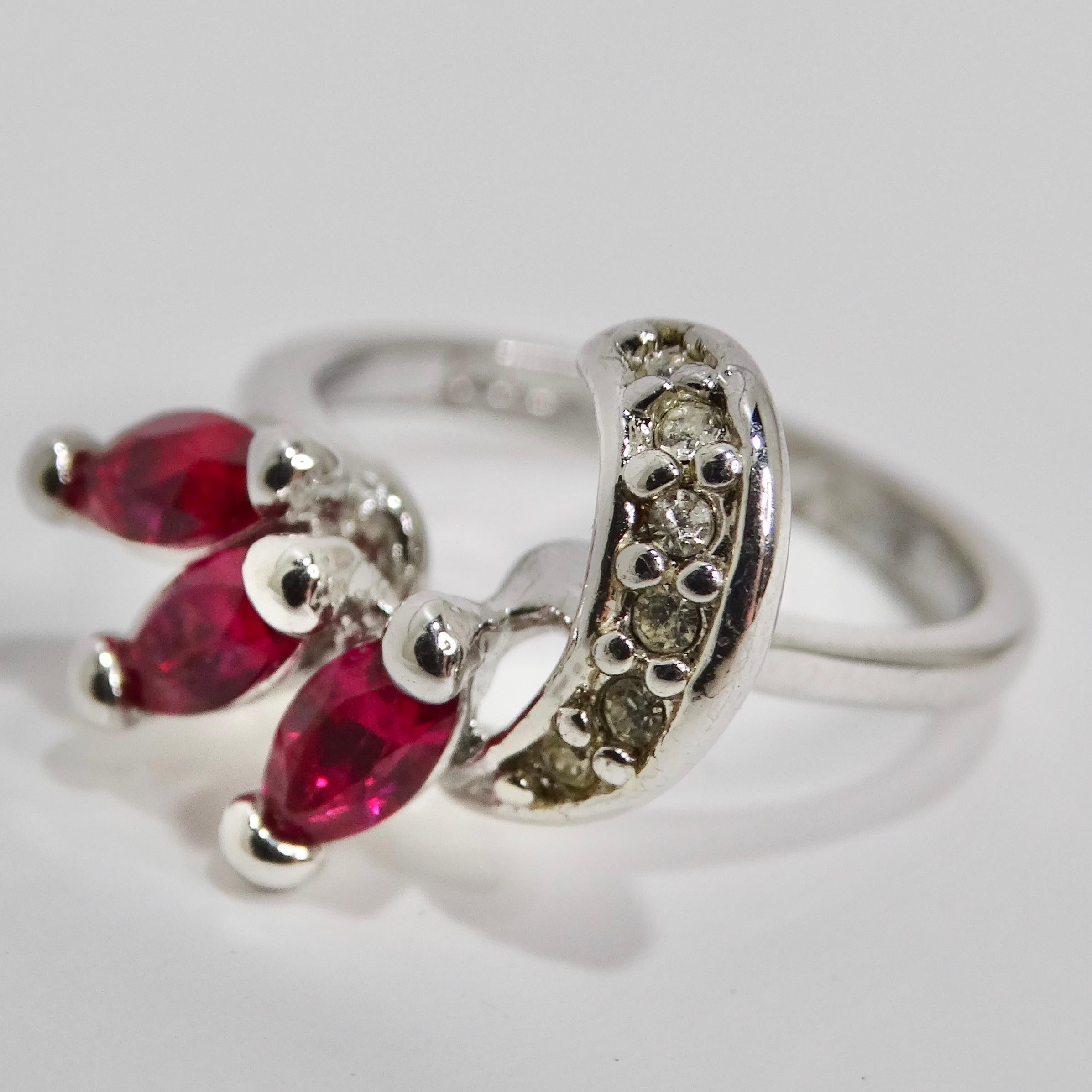 Embrace the enchanting spirit of the 1970s with our exquisite Silver-Gold Plated Ring, adorned with three vibrant synthetic rubies and sparkling synthetic diamonds. This timeless piece features a whimsical motif that effortlessly blends subtlety