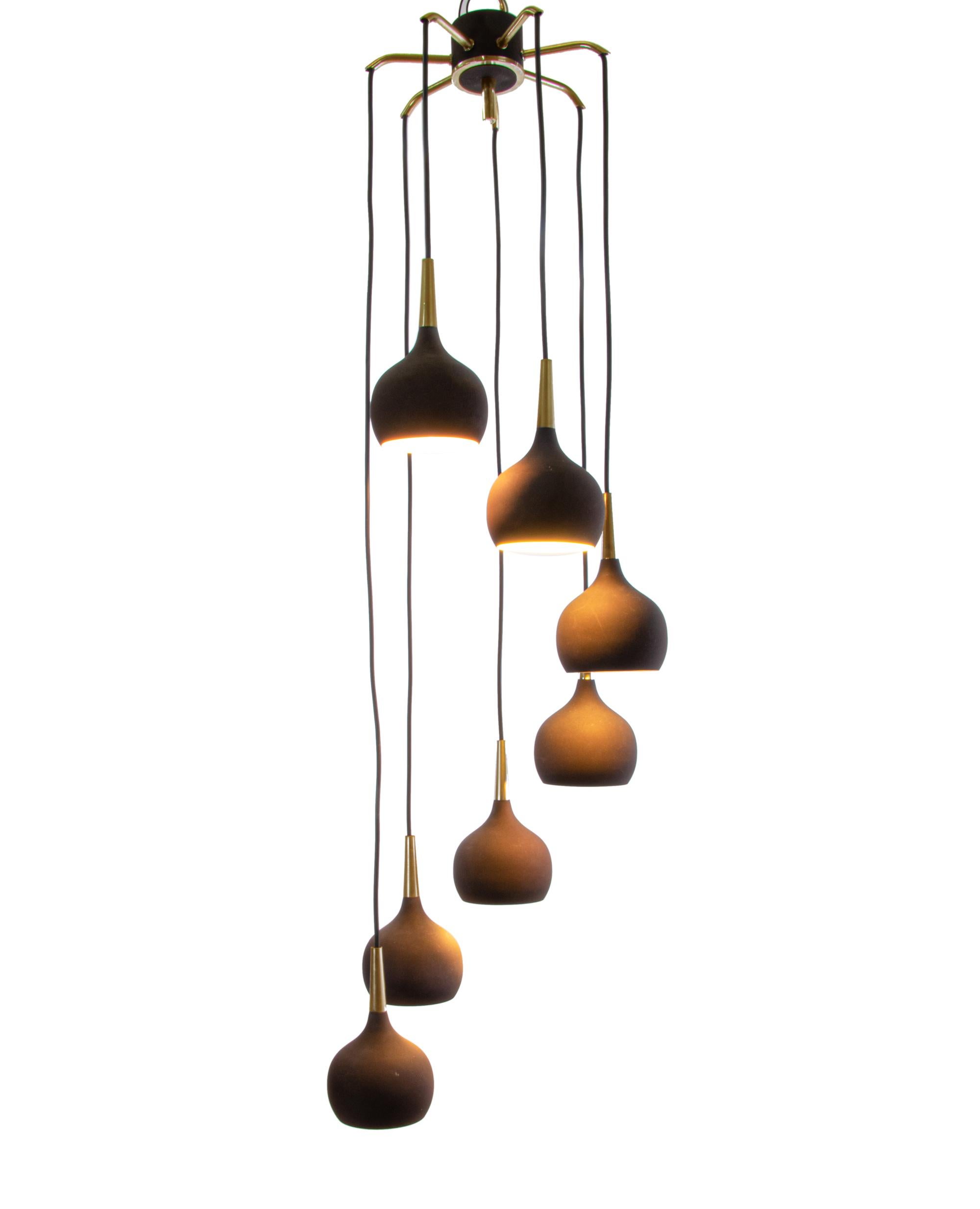 Elegant dome pendant light with seven drop-shaped shades in dark-brown metal with brass mounting. With this light you make a clear statement in your interior design. A real eye-catcher even unlit. Designed by Hans-Agne Jakobsson (1919-2009) for AB