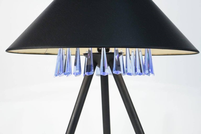 1970 Table lamp designed by Chrystiane Charles for the Maison Charles.
Referenced in the Maison Charles catalog.

Composed of a tripod in black lacquered metal of round section placed on 3 small balls in gilded brass.
On the upper part is placed a