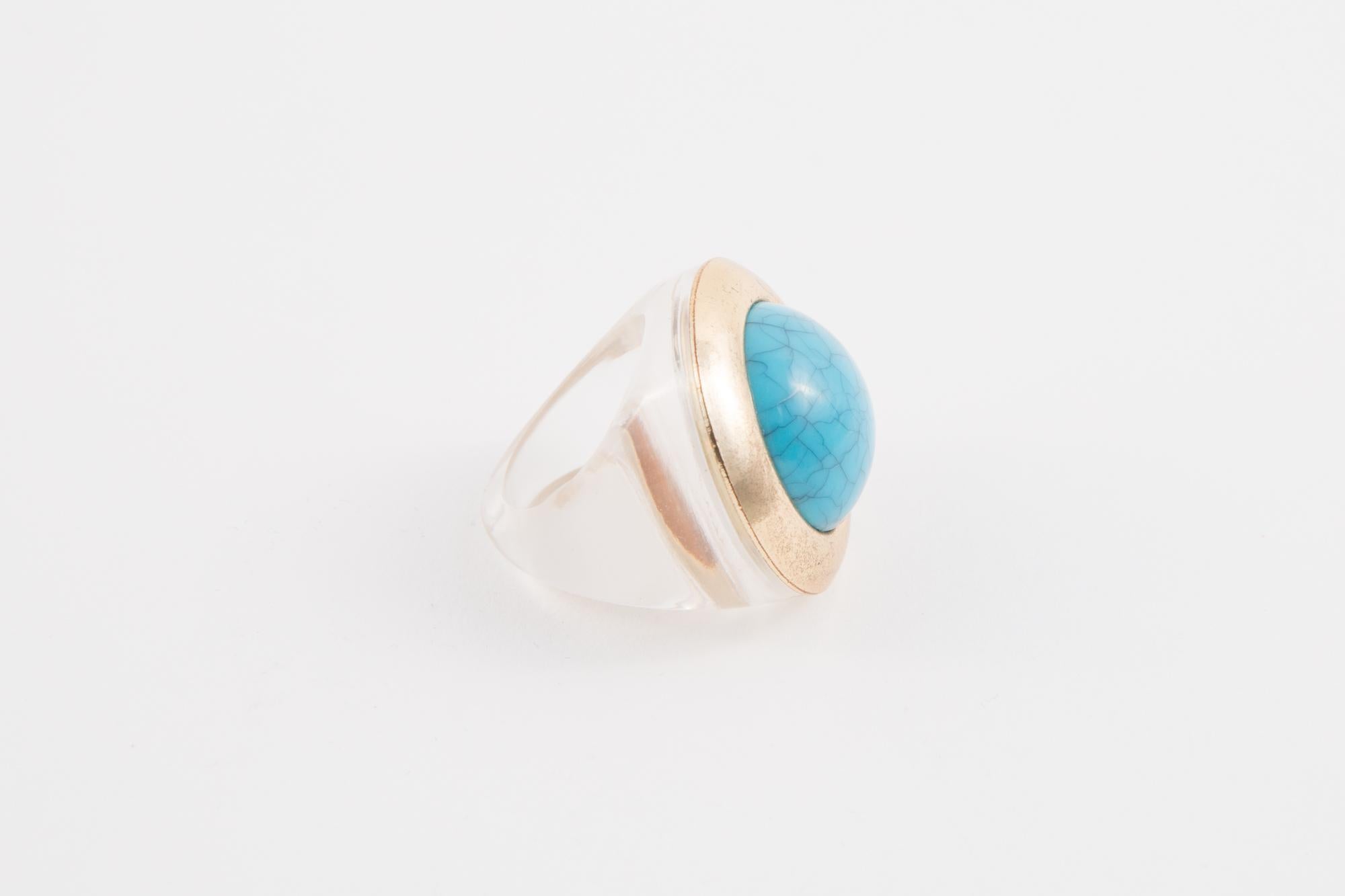 1970s Transparent resin ring featuring a turquoise cabochon and gold ring around. 
Finger diameter:0.8in. (2cm) 
Turquoise 1in (2.5cm) X 1in (2.5cm)
In good vintage condition  
We guarantee you will receive this gorgeous item as described and showed