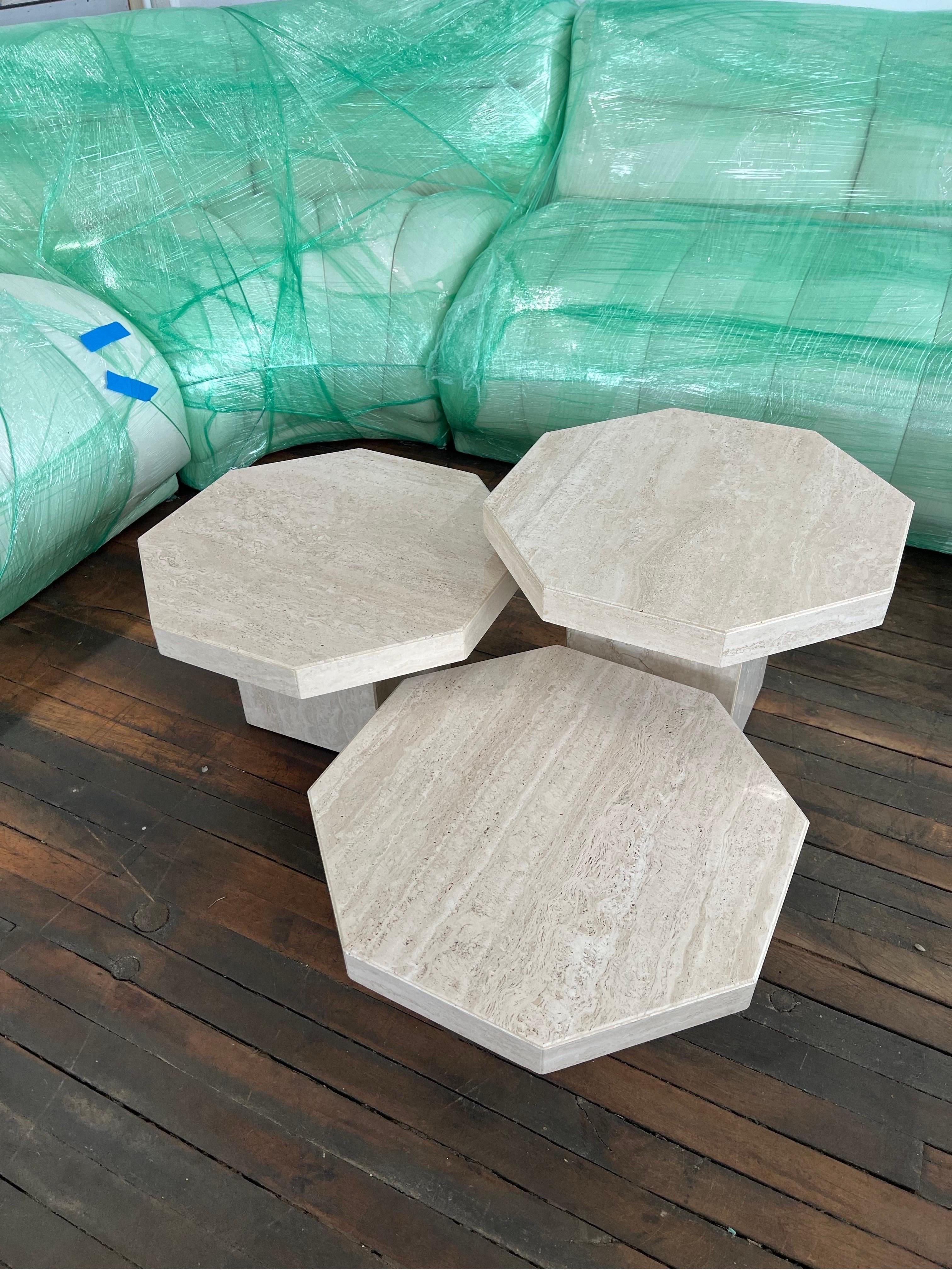 1970 Travertine Octagon Nested Tables - a Set of 3

This set is made in Italy, as shown on the label underneath the table top.

Three different heights: 9”, 12”, 15” so they can perfectly nest under each other