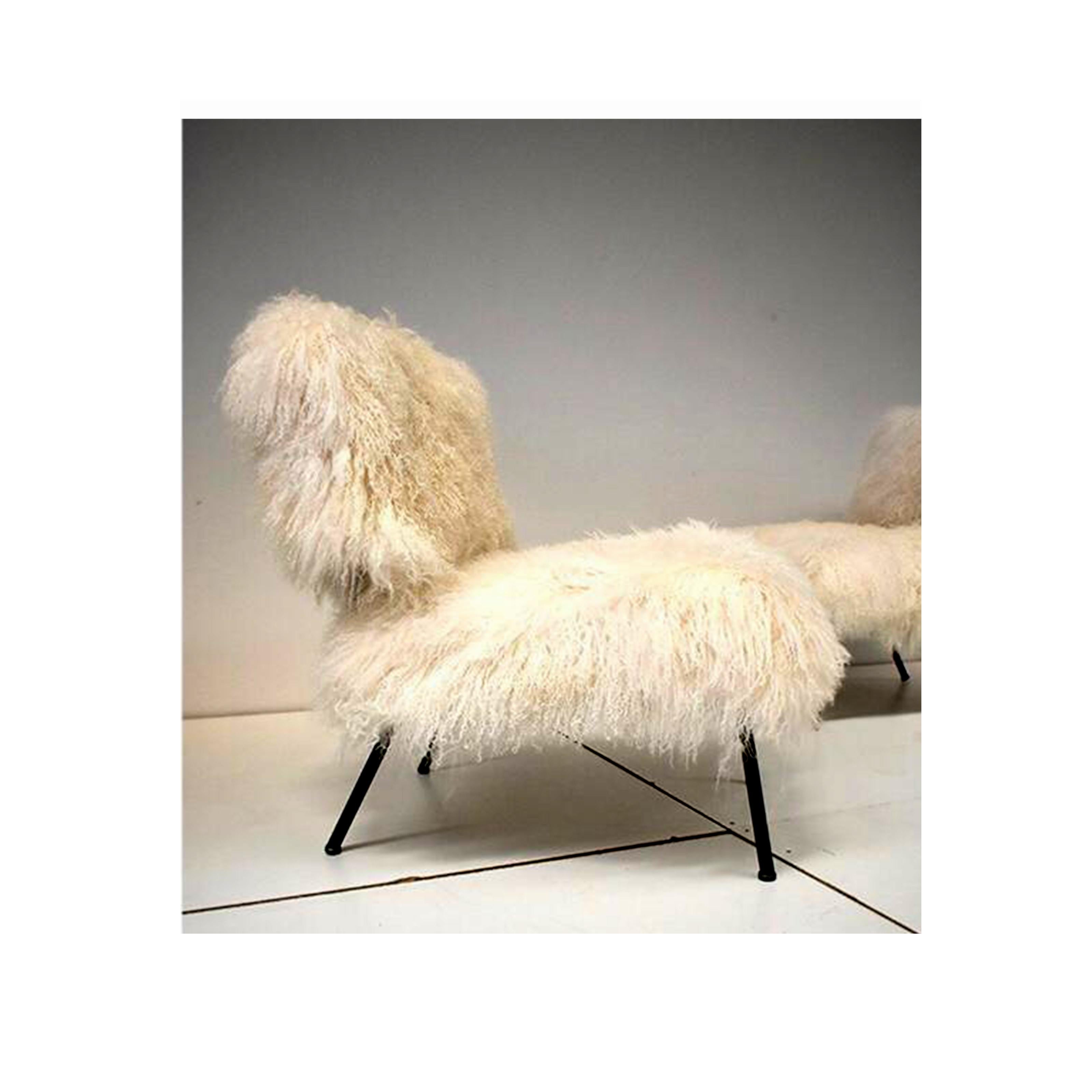 Vintage armchair from the 1970s, Italian manufacture.
The armchairs have an iron paw with seat and back upholstered in Mongolian goat fur.