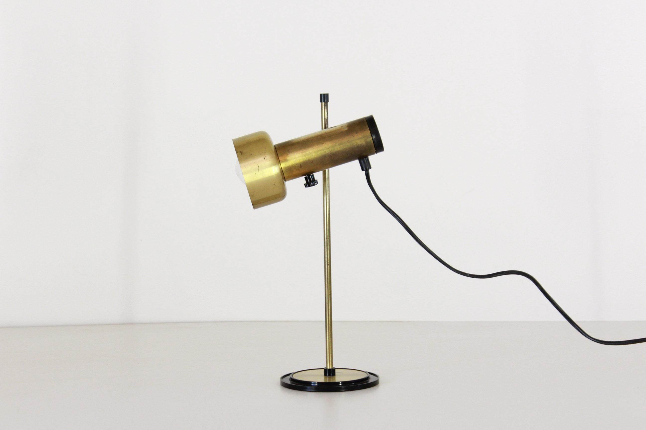 A 1970s vintage desk lamp with brass structure. Flexible light globe. E27 light. In good conditions with only few signs of time.