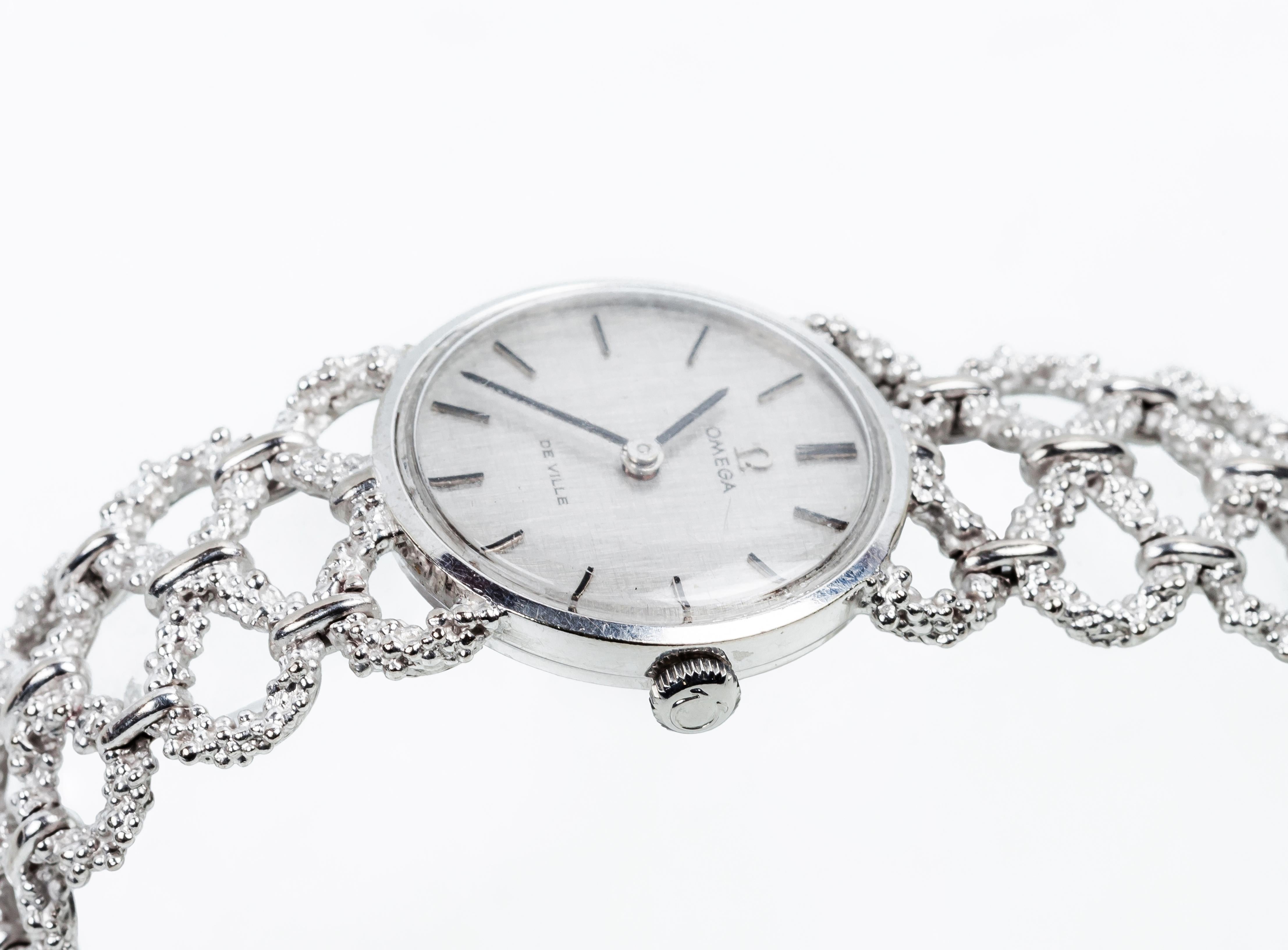 Montre Omega vintage pour dames en or 18 carats 
Boîtier de 23 mm et bracelet ajouré en 