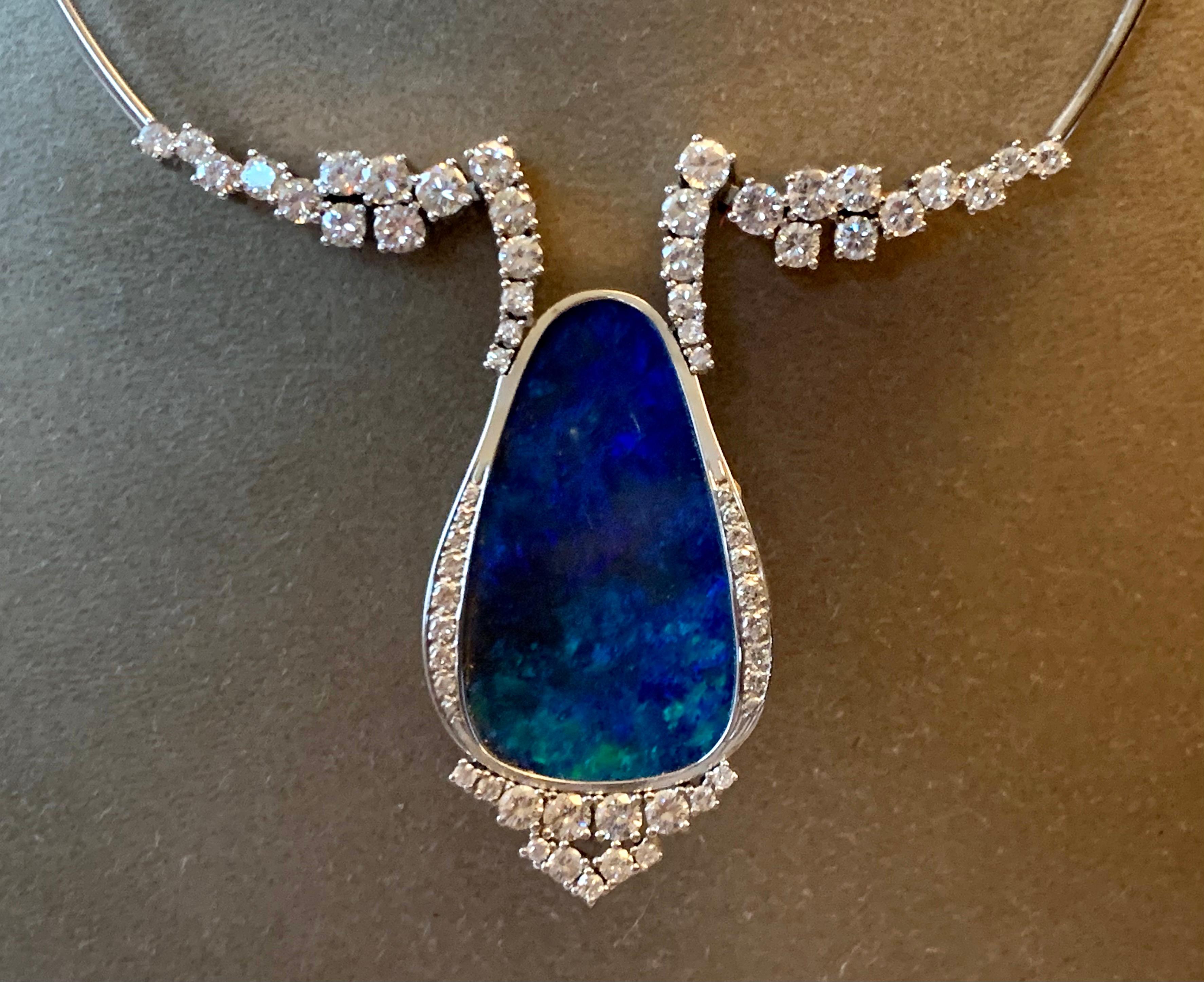 Very attractive and solid handmade 18 K white Gold necklace with Black Opal triplet and 63 brilliant cut Diamonds weighing approximately 6 ct, G color, vs clarity. 
Length: 40 cm
Dimension of the opal pendant: 4.9 cm and widest point: 2.80
