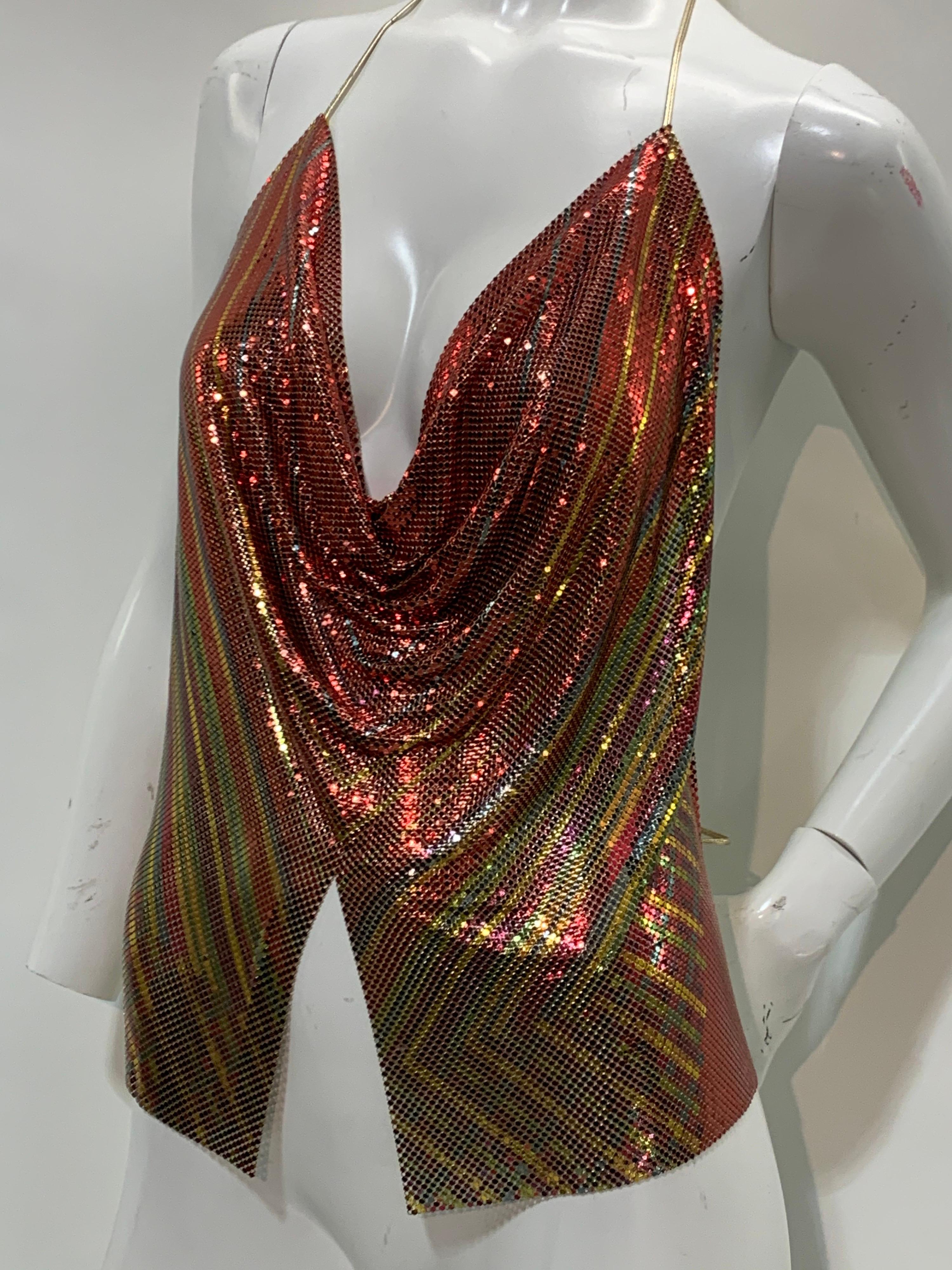 An unusual 1970s Whiting & Davis slinky metal mesh disco halter top in stripes of copper, gold and green. Gold leather ties at neck and back and felt edged at underarms for maximum comfort and freedom. Adjustable medium size. 