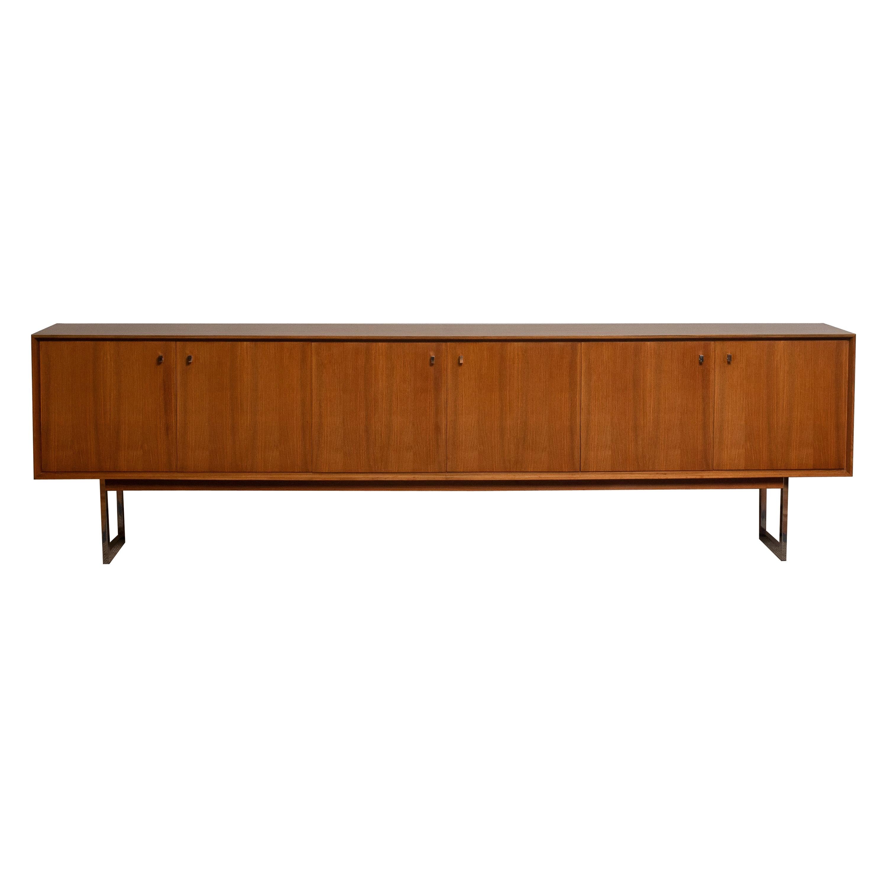 Extreme beautiful and extra wide credenzas / sideboard, 118 inches, in walnut on chrome legs.
It's a great quality piece and the overall condition is very good!
  