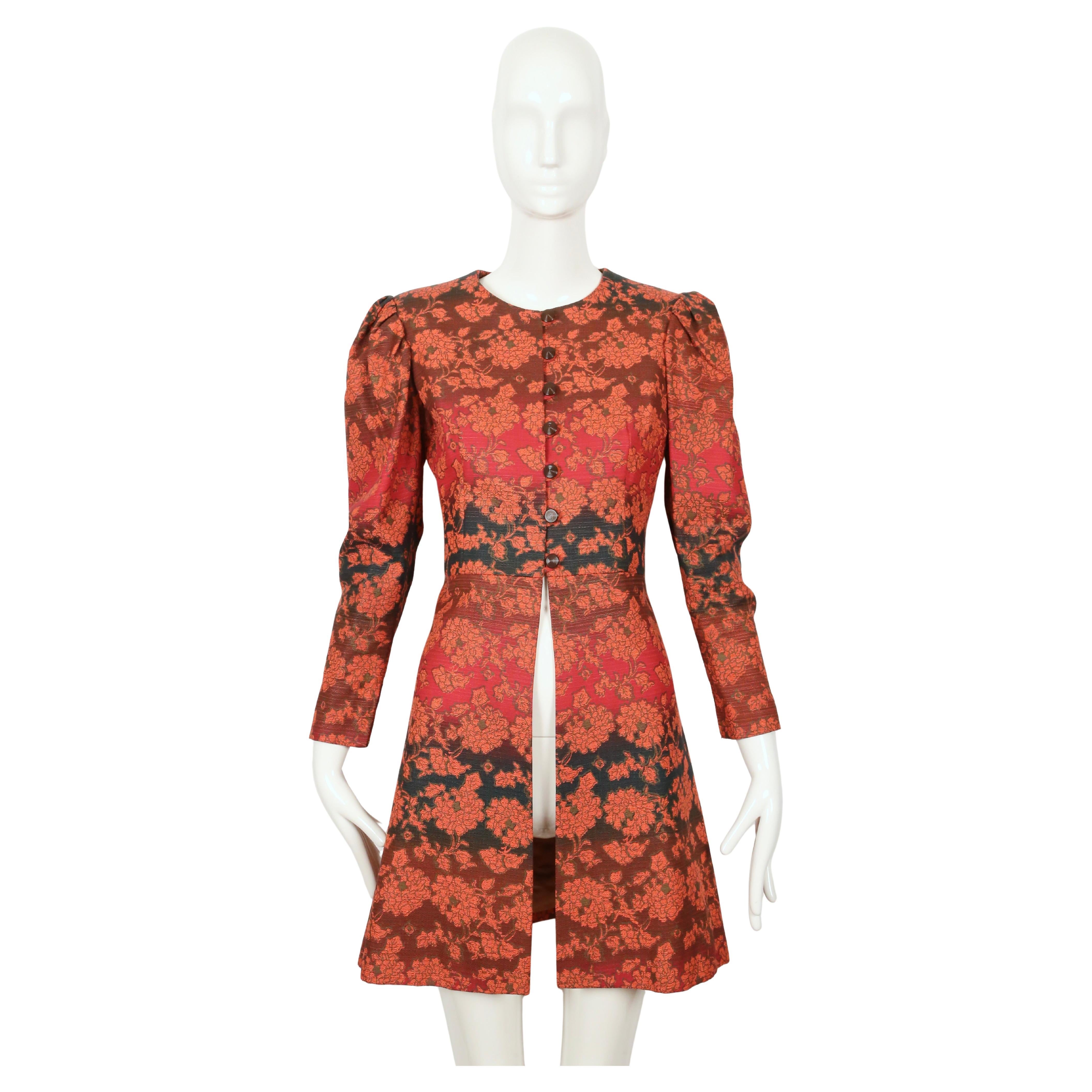 Very rare, vivid gradient toned floral coat with puff sleeves from Yves Saint Laurent dating to 1970. Coat best fits a US size 2 or 4. Approximate measurements: shoulder 14