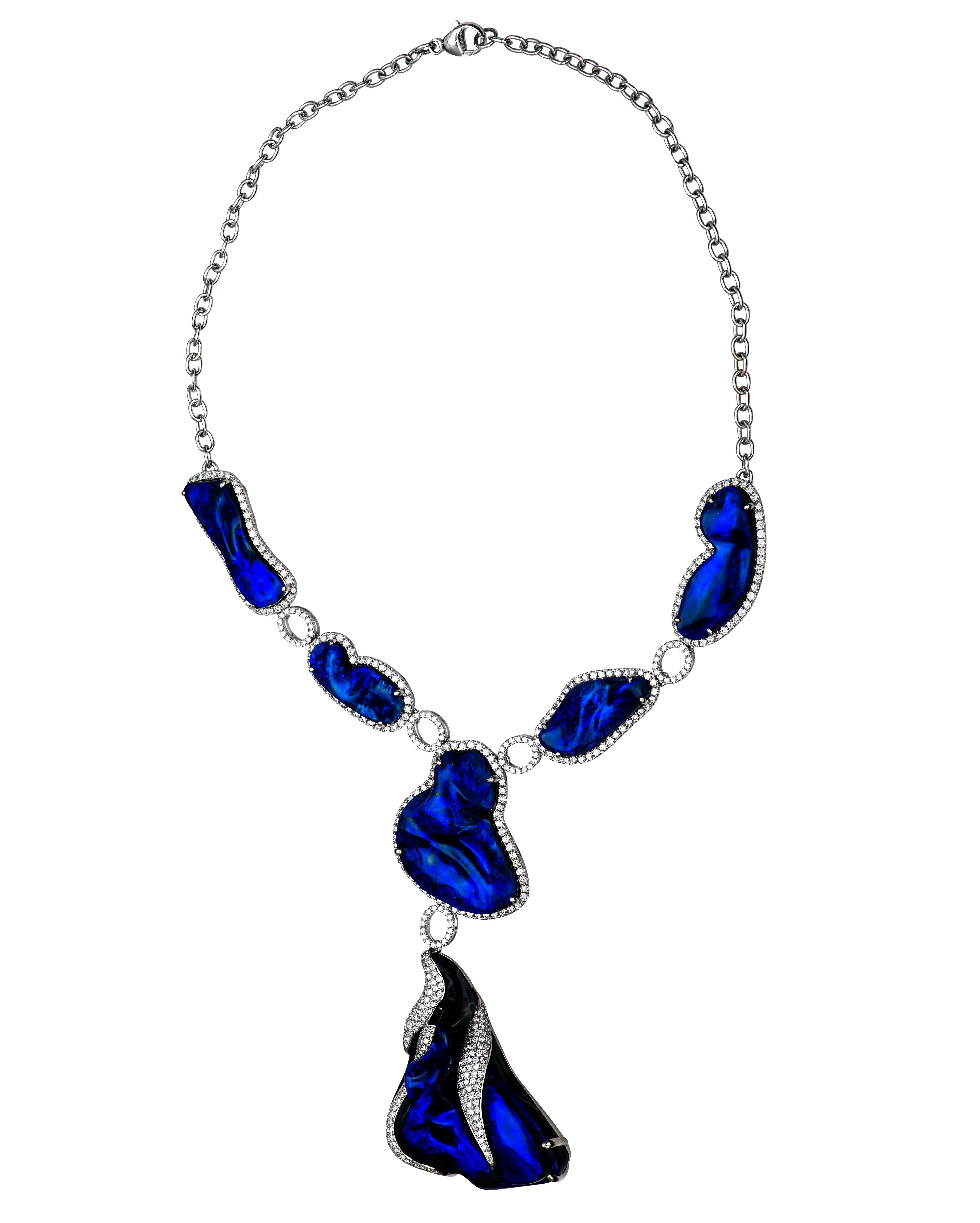 This outrageous necklace is one of the most coveted, spectacular pieces we have ever seen. With a whopping 197.00ct total weight in natural black opals from Lightning Ridge, Australia, this two-time AGTA Spectrum Award-winning piece by the John Ford