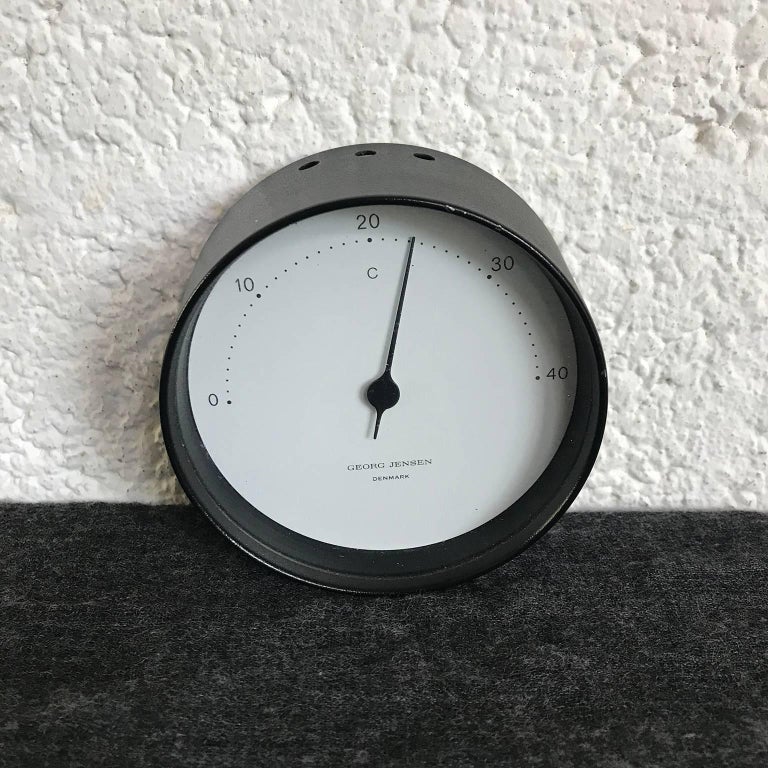 Weatherstation set by Georg Jensen, Denmark. Timeless design and luxury. This set contains a Thermometer in Celsius, a time clock, a barometer and a hygrometer. The set shows traces of wear like tiny scratches and tiny spots/loss of paint on the
