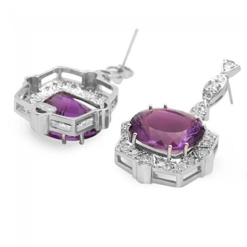 19.70ct Natural Amethyst and Diamond 14K Solid White Gold Earrings

Total Natural Oval Amethyst Weight: 17.90 Carats 

Amethyst Measures: Approx.  16 x 14 mm

Total Natural Round Cut White Diamonds Weight: Approx.  1.80 Carats (color G-H / Clarity