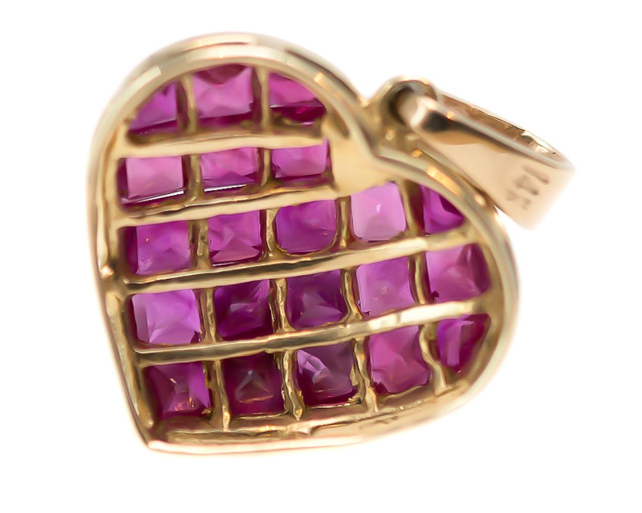 1970s Ruby Heart Pendant - 14 Karat Yellow Gold, Rubies

Features:
1.0 carat total Princess cut Rubies
Pinkish Red Rubies
14 Karat Yellow Gold
Puffed Design with Open Gallery 
Rubies are Invisible Set in a Diamond Pattern

Heart Measures 14