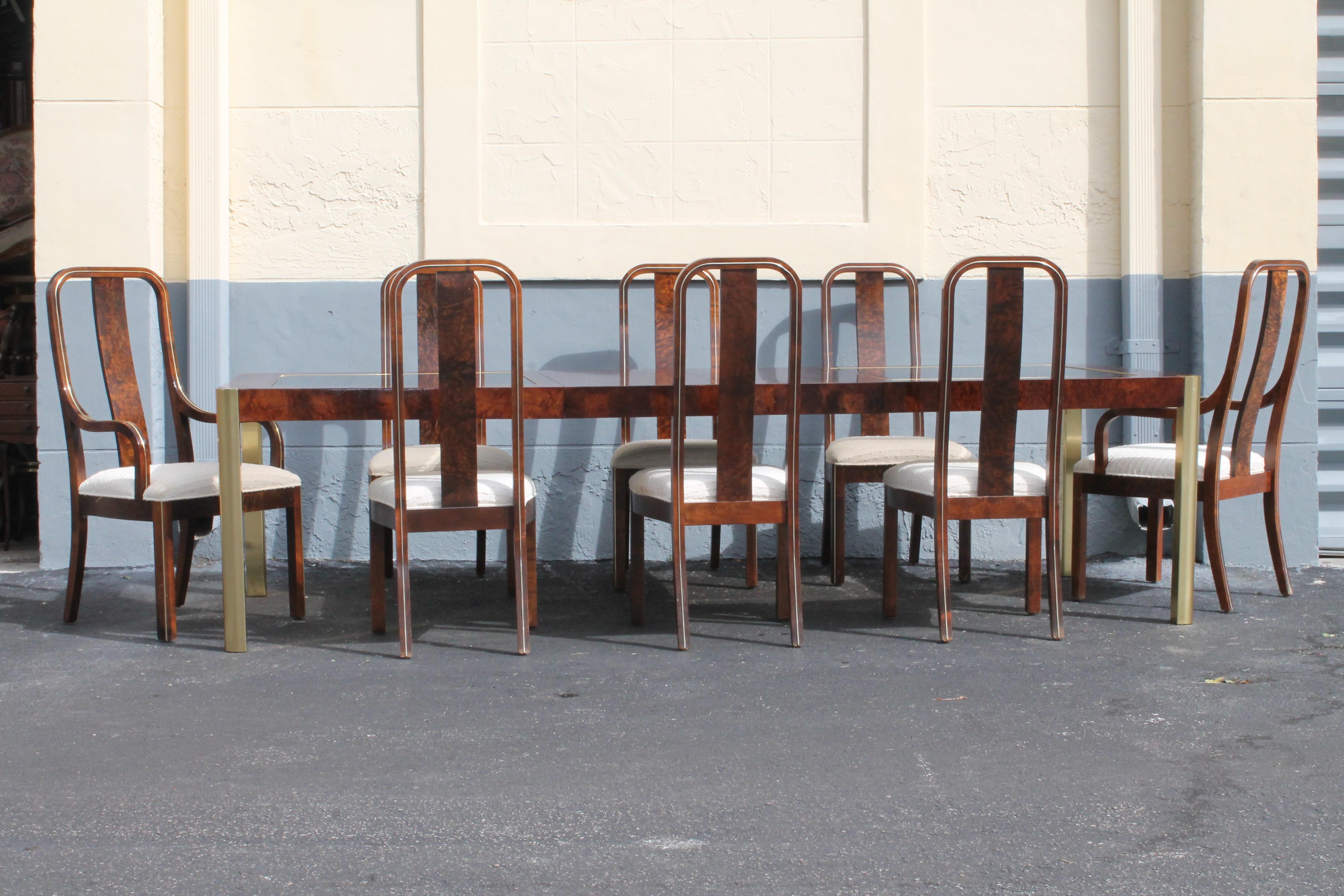 1970's Ultra Modern 11 Piece Dining Set by Century Furniture. Exotic Burlwood with bevelled bronze toned glass top. 8 chairs, stunning bent burlwood design. 2 armchairs and 6 side chairs, bronze glass inserts on top of brass toned burlwood