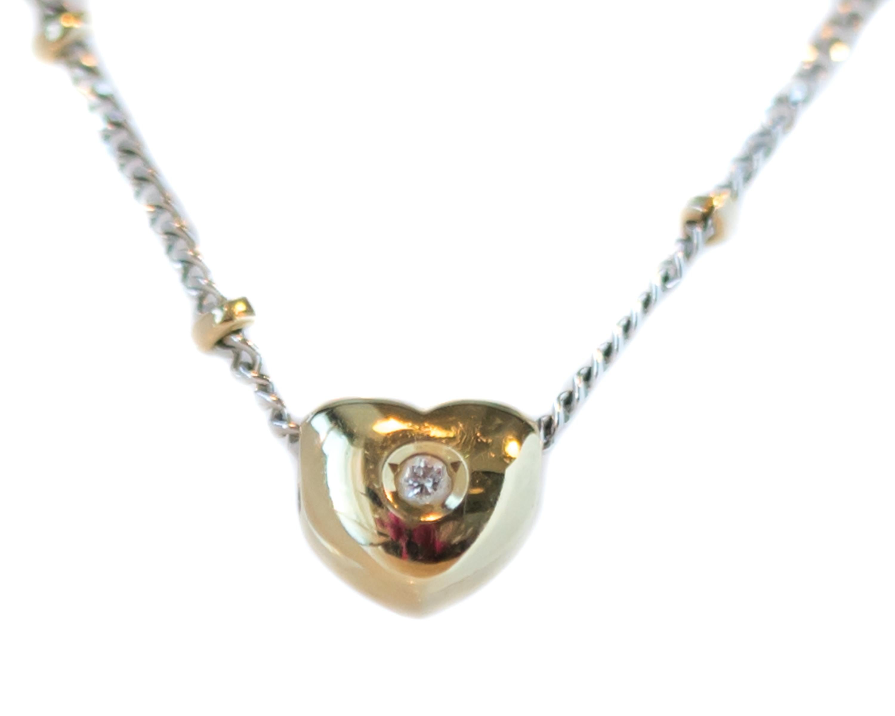1970s Puffed Heart Necklace with Beaded Chain - 14 Karat Yellow Gold, White Gold

Features:
14 Karat Yellow Gold Floating Puffed Heart
14 Karat White Gold Link Chain Segments alternating with 14 Karat Yellow Gold Fixed Beads
14 Karat Yellow Gold
