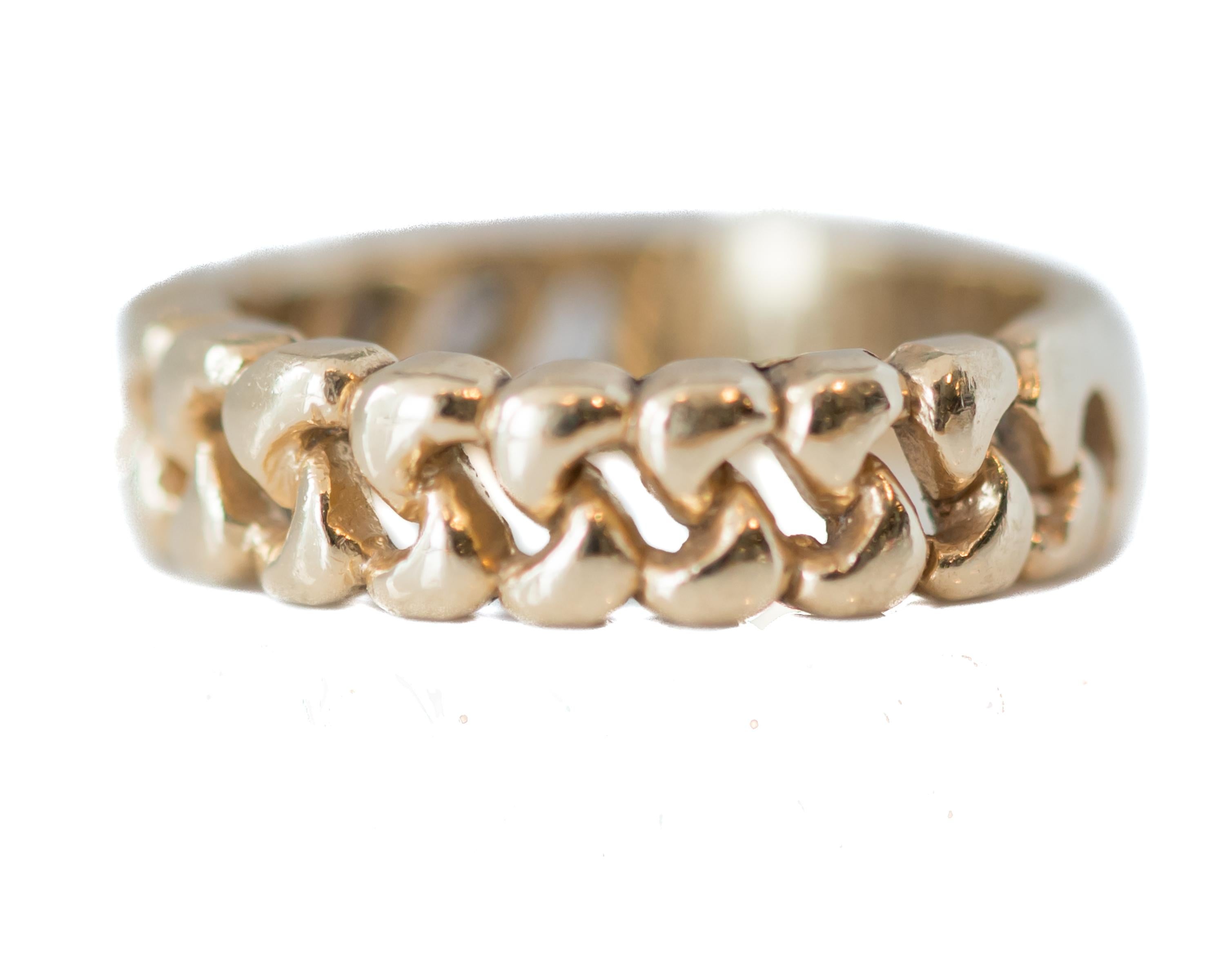 Gold Cuban Link Band Ring - 14 Karat Yellow Gold

Features:
Rich 14 karat Yellow Gold
Cuban Link Pattern 3/4 way around
Smooth center back
Inner shank engraved 1 NOV 1975
4.5 millimeters wide
Finger to top of ring 2 millimeters
Ring fits a size