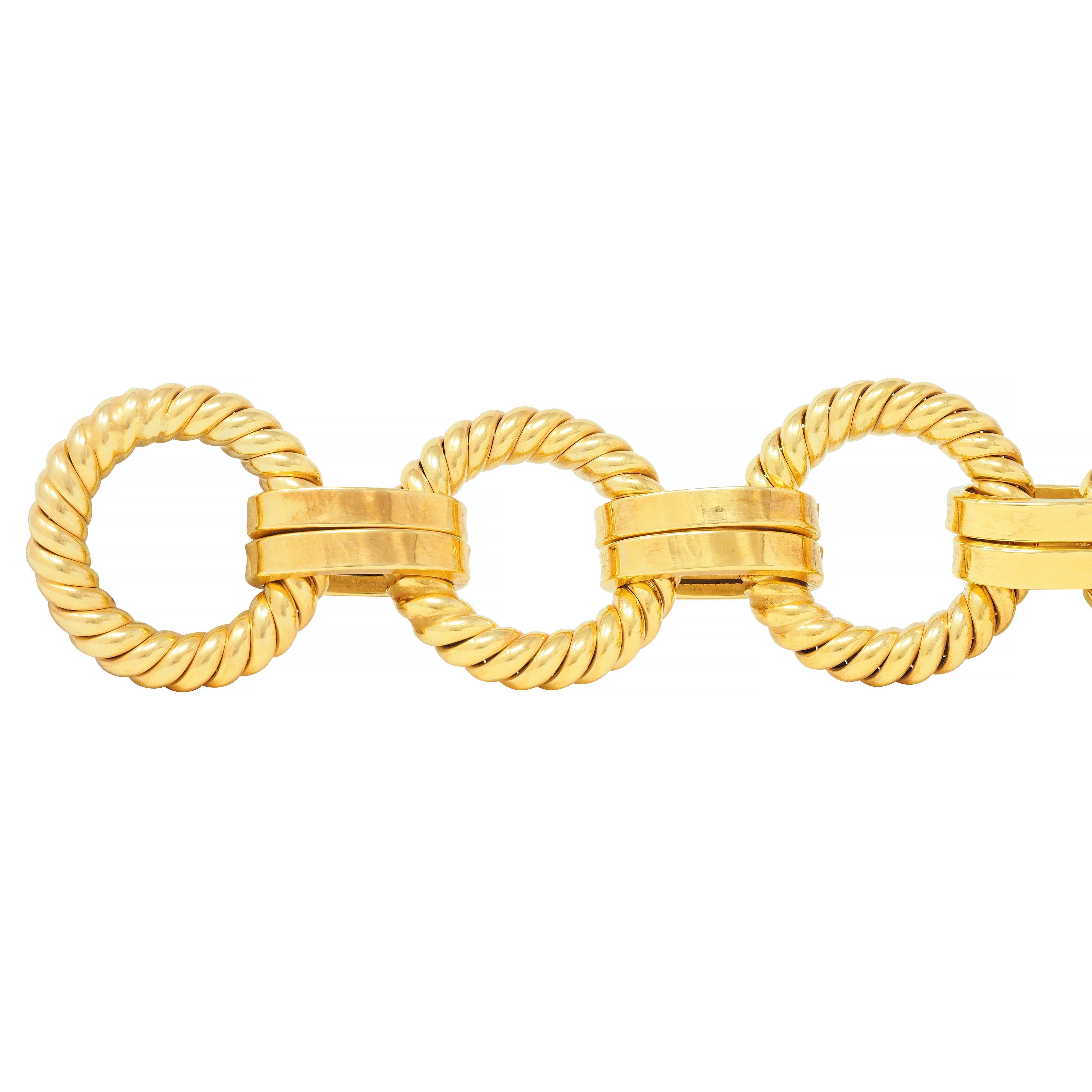 Comprised of large circular twisted rope motif links 
Alternating in pattern with doubled oval bar links 
Completed by toggle clasp connected via cable link chain
Stamped for 14 karat gold 
Circa: 1970s 
Width at widest: 1 1/8 inches
Bracelet size: 