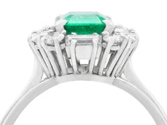 1970s 1.43 Carat Emerald and Diamond Platinum Cluster Ring