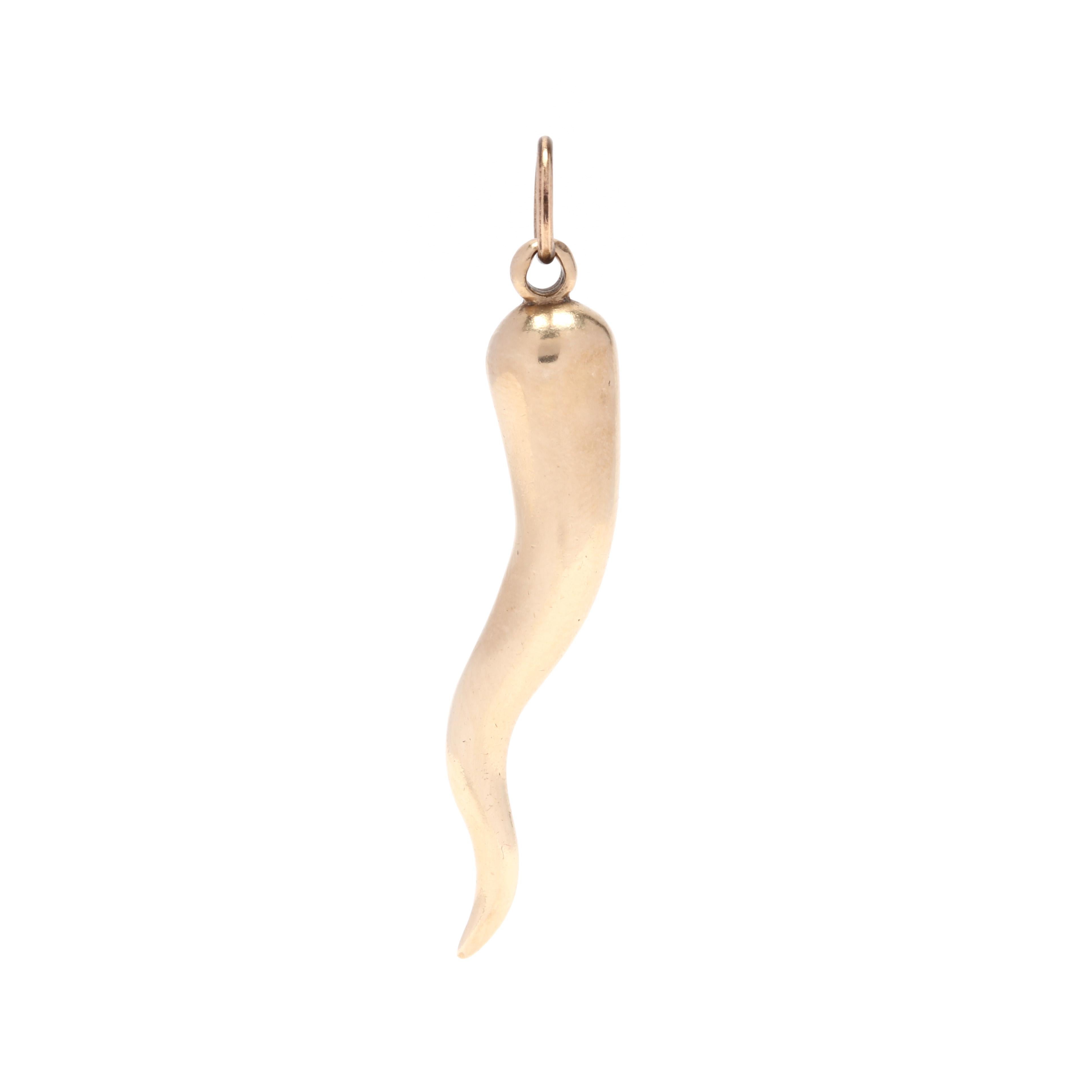 A 1970's 14 karat yellow gold Italian horn solid charm / pendant. This solid gold pendant features a curved horn design with a thin bail.

Length: 1.75 in.

4.95 dwts.

* Please note that this is a vintage item and may show signs of wear. It has