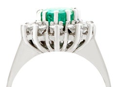 1970s 1.50 Carat Emerald and 1.12 Carat Diamond Gold Cluster Ring