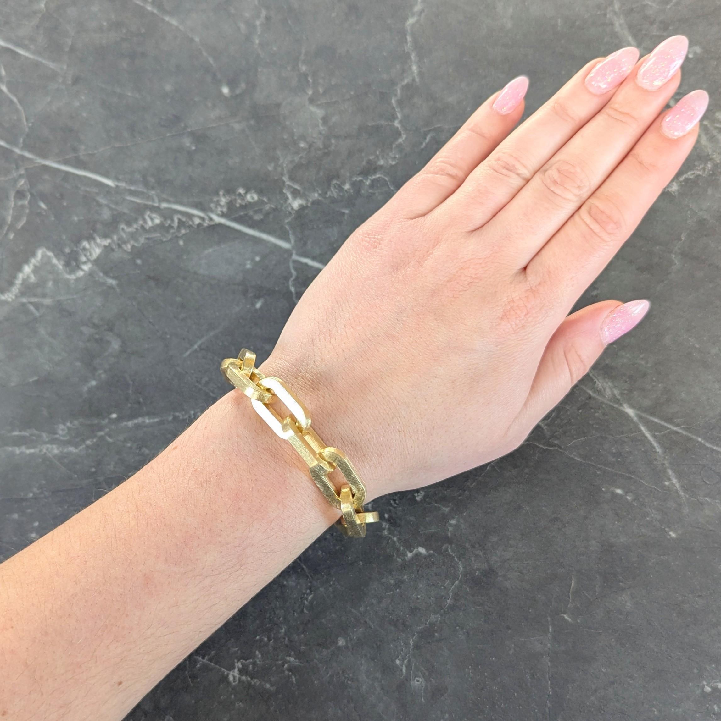 Designed as a cable link chain comprised of oval shaped links
Featuring a fine brushed linear engraving throughout
Completed by concealed hinged clasp
Stamped with Italian assay marks for 18 karat gold
Stamped for Italy
Circa: 1970s
Width at Widest: