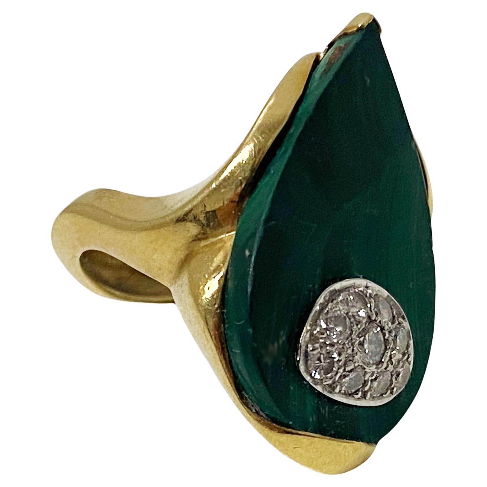 1970's 18ct Malachite Diamond Ring, possibly English. Custom hand made abstract form set with a pear shaped malachite surmounted with nine round brilliant cut pave set diamonds within eye like setting, the gold mount and undulating shank conforming