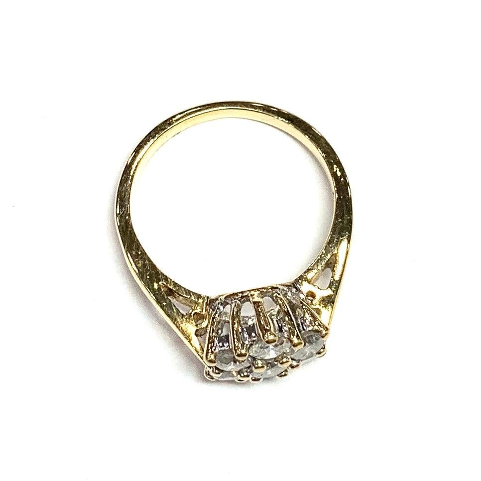1970s 18ct Yellow Gold Seven Stone Diamond Cluster Ring. Set with seven fine quality round brilliant cut diamonds in a handmade Yellow gold mount.

Approximate total Diamond weight : 1.05ct
Total weight : 4.5g
Ring size : L