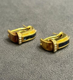 1970s 18k gold earrings adorned with diamonds and baguette cut sapphires
