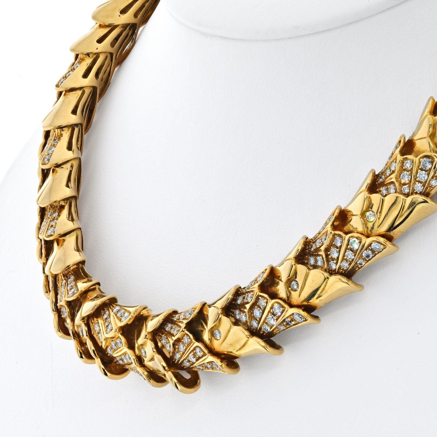 Elegant and sophisticated, this 18k gold necklace is exceptionally flexible, allowing it to sit beautifully on the neck. The necklace is generously sized at 15mm wide and constructed of individual links assembled with diamond set scale like design.