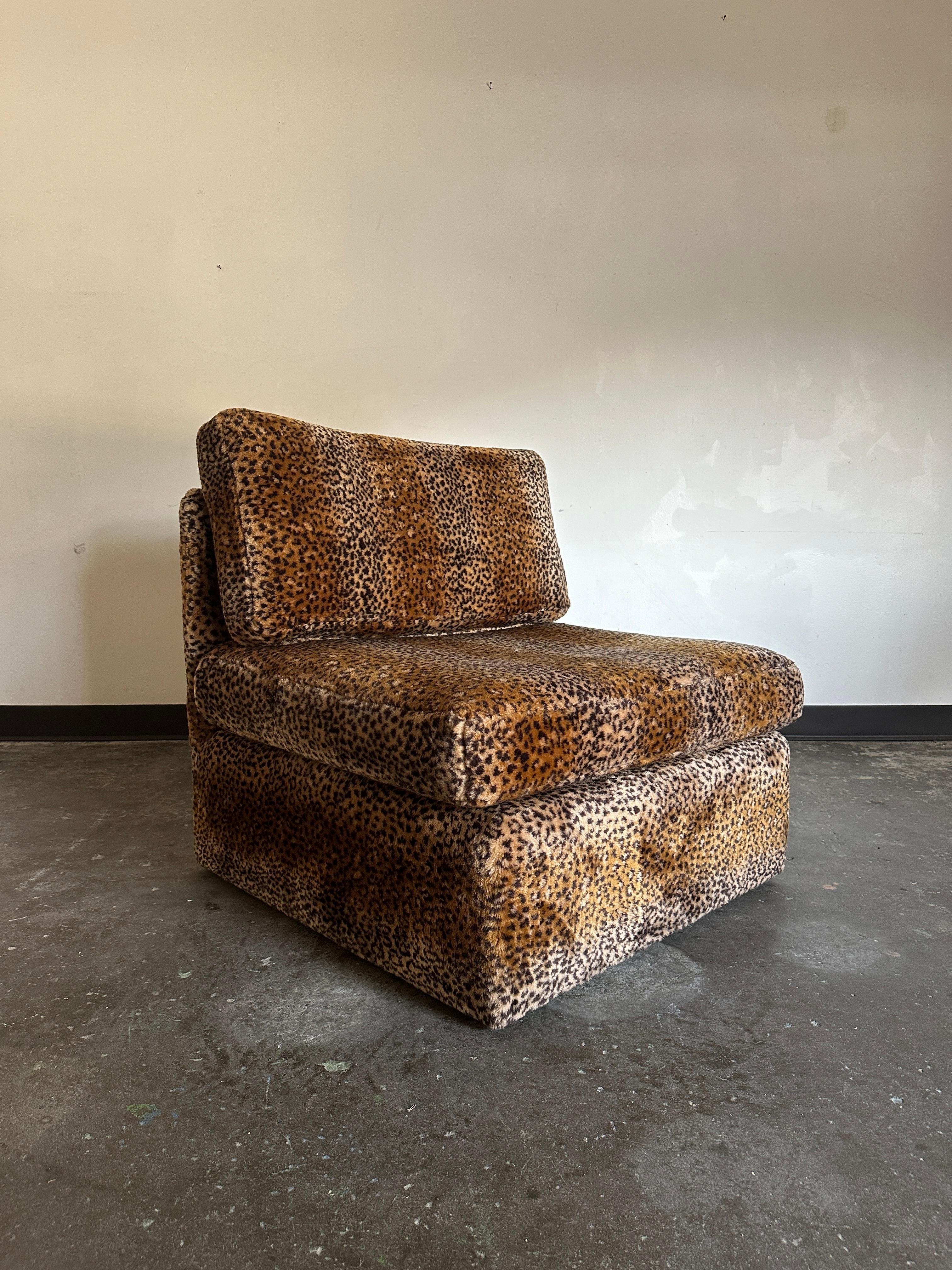Fluffy leopard print slipper chair feels like your favorite stuffy. Chair is in excellent condition for its age with minimal, if any, signs of wear.

Dimensions:
Seat width: 31