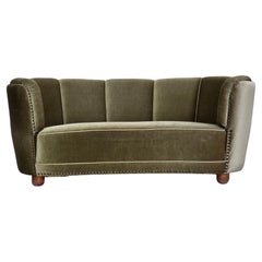 1970s, 2-seater Danish "Banana" sofa, green furniture velour, oak wood legs.