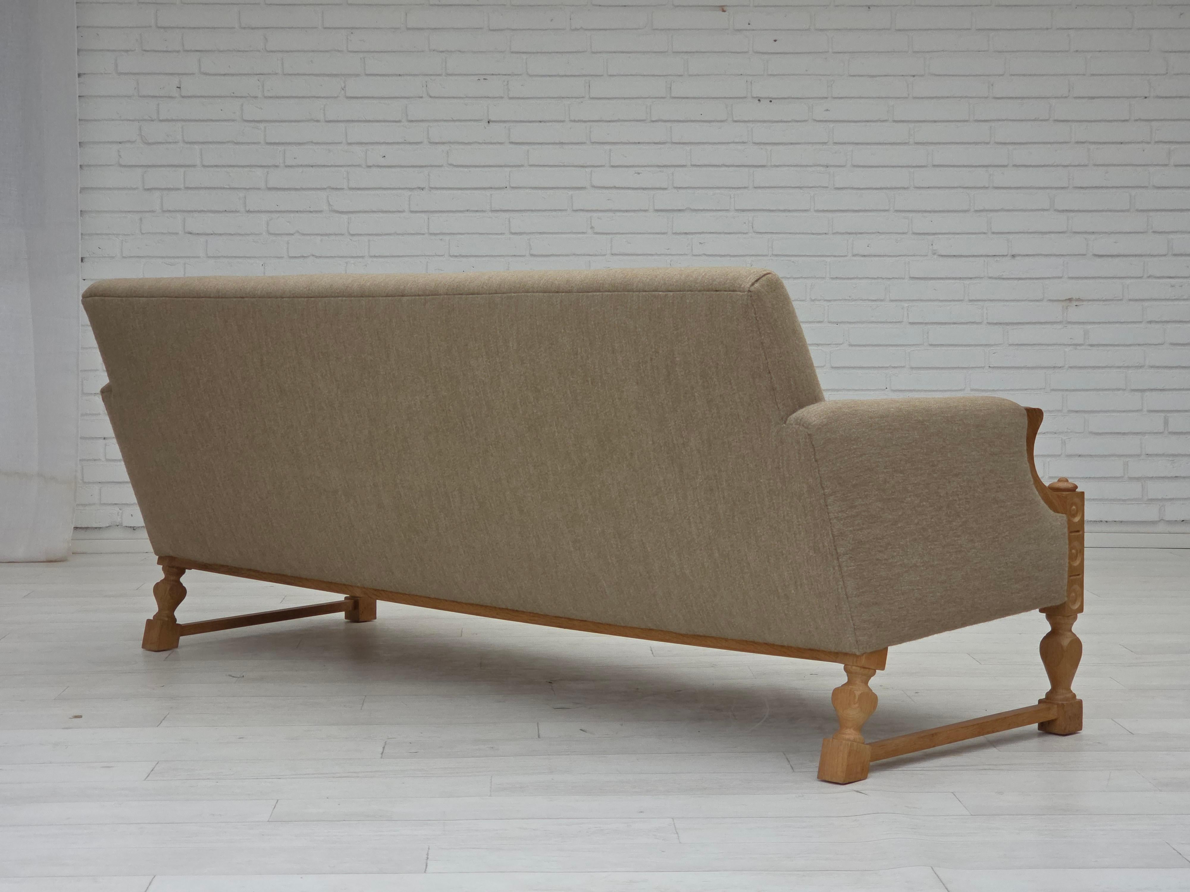 Wool 1970s, 3-seater Danish sofa, original beige furniture wool, solid oak wood. For Sale