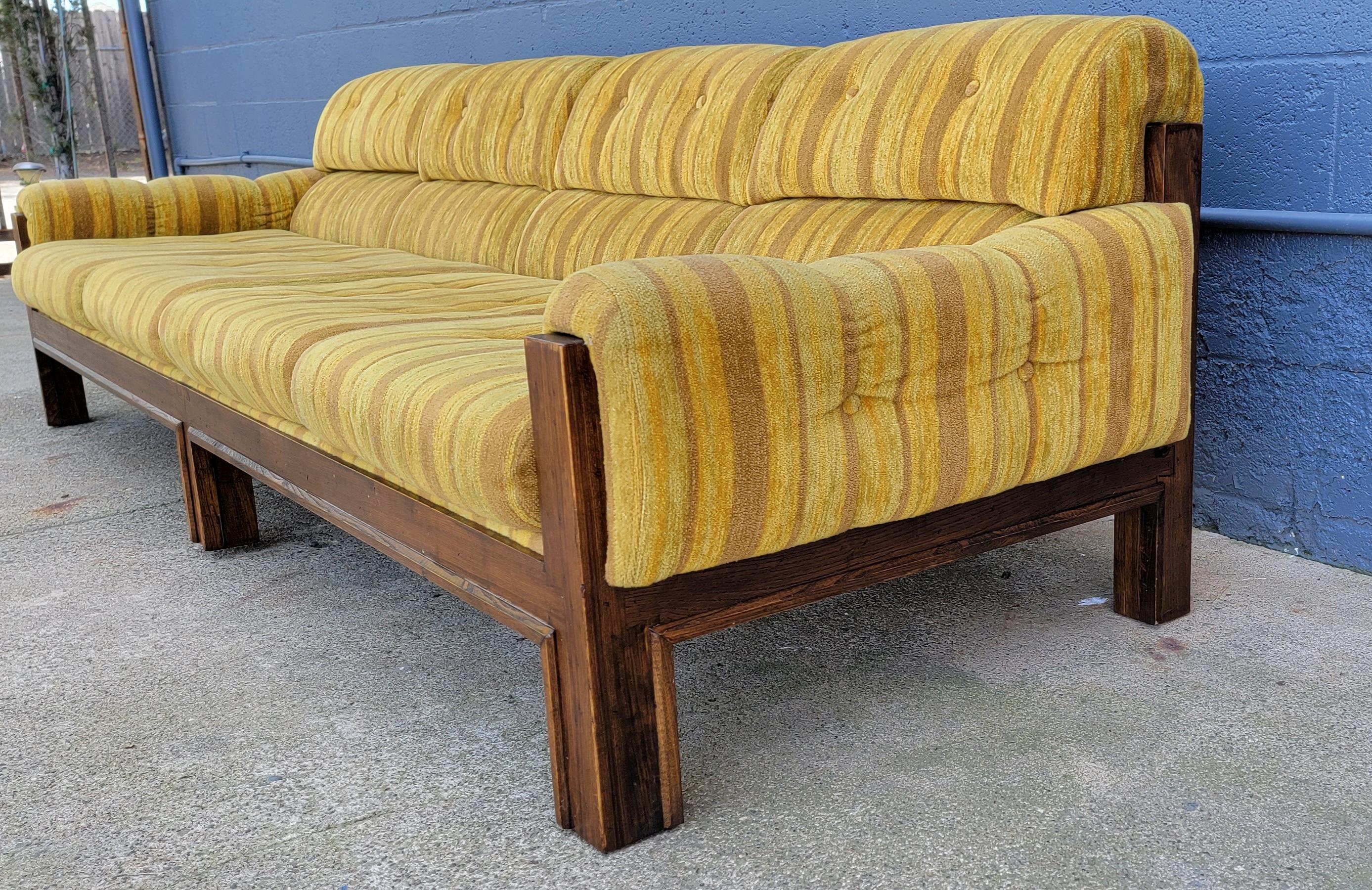 Over-sized four seat sofa with original upholstery. Solid oak frame is structurally very sturdy. Original fabric is in amazing condition considering its age, but does have light wear. All foam is soft and comfortable. Notice large dovetail detail at