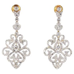 Pendientes de oro de los años 70 con un diamante redondo de talla brillante de 4,29 quilates