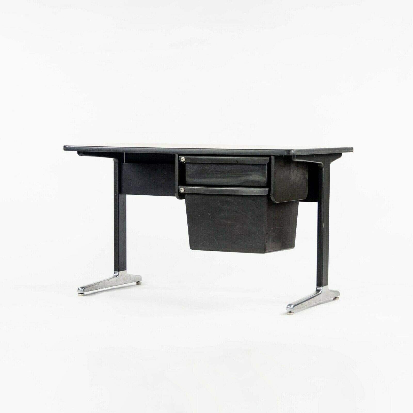 Listed for sale is a 1970s vintage Herman Miller Action Office desk, designed by George Nelson. This is a classic example of Nelson's work with great emphasis on simplicity and functionality. It has cast aluminum legs and basket-like pull-out