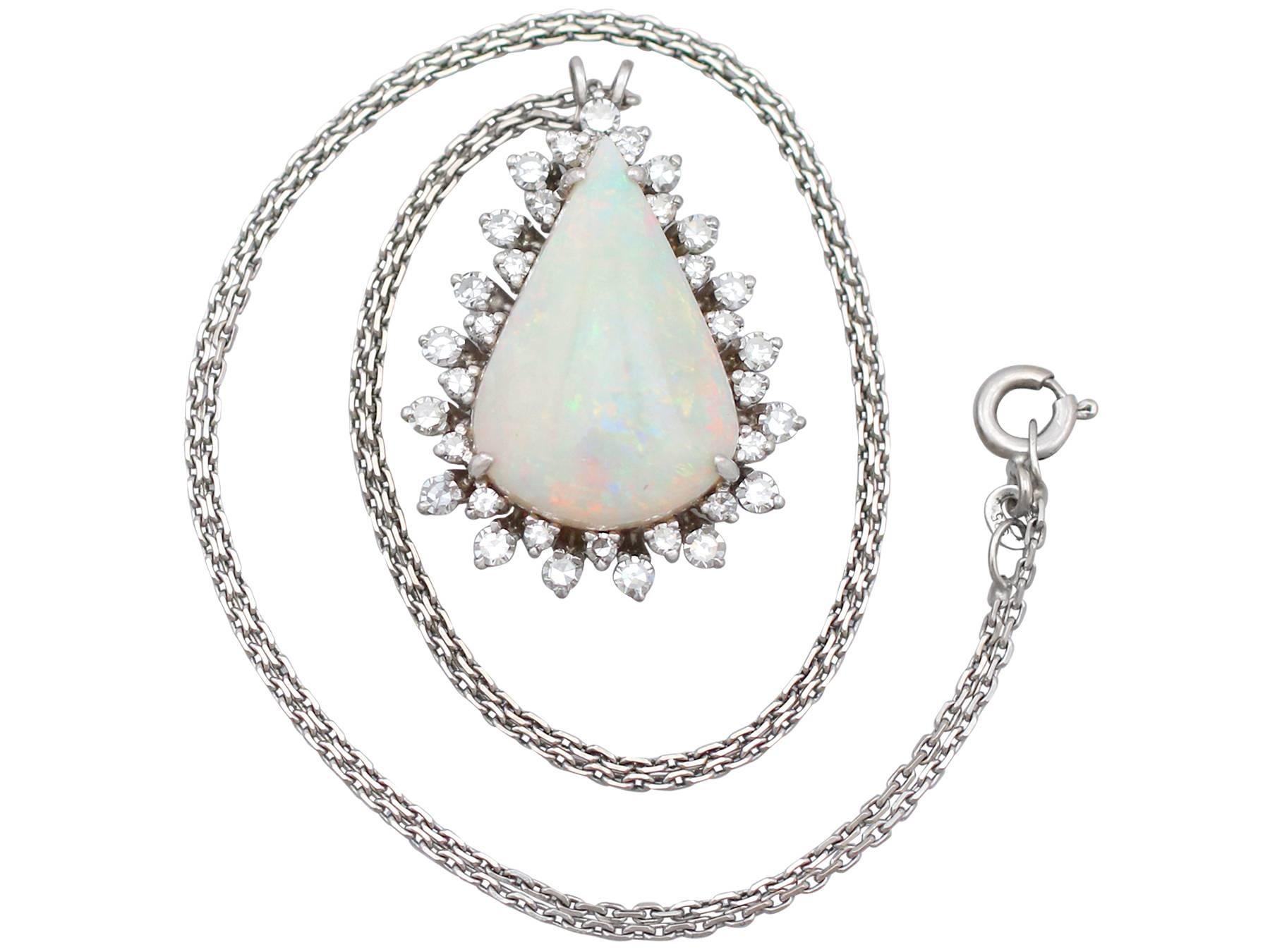 An impressive vintage 8.02 carat white opal and 1.36 carat diamond, 18 karat white gold pendant with 14 karat white gold chain; part of our diverse gemstone jewelry collections.

This fine and impressive vintage opal and diamond pendant has been