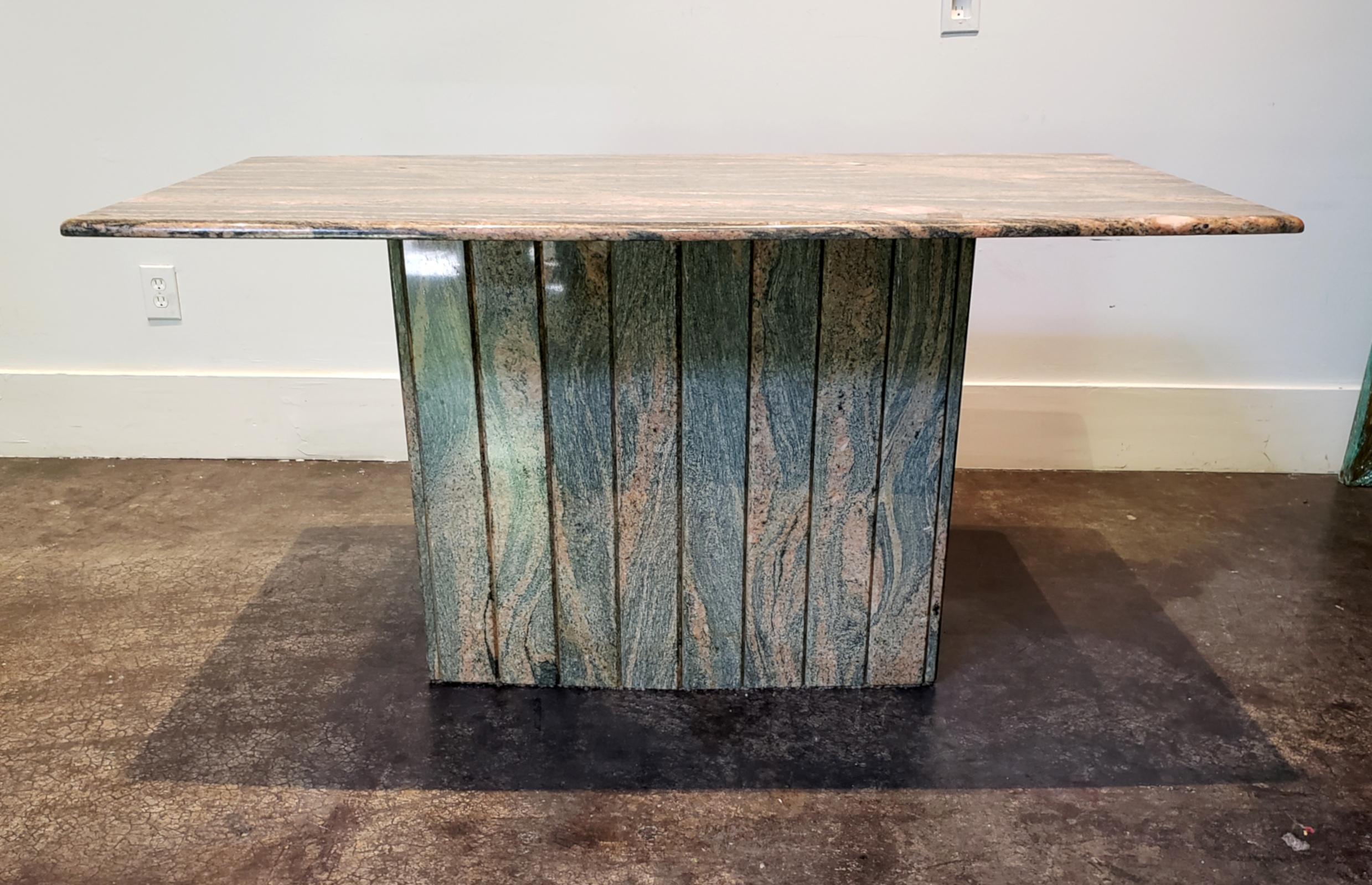 1980s Italian console table in stunning pink and grey marble. Rounded rectangular top on vertically grooved base. Both are wider at the center. 

Measures: Top is 60
