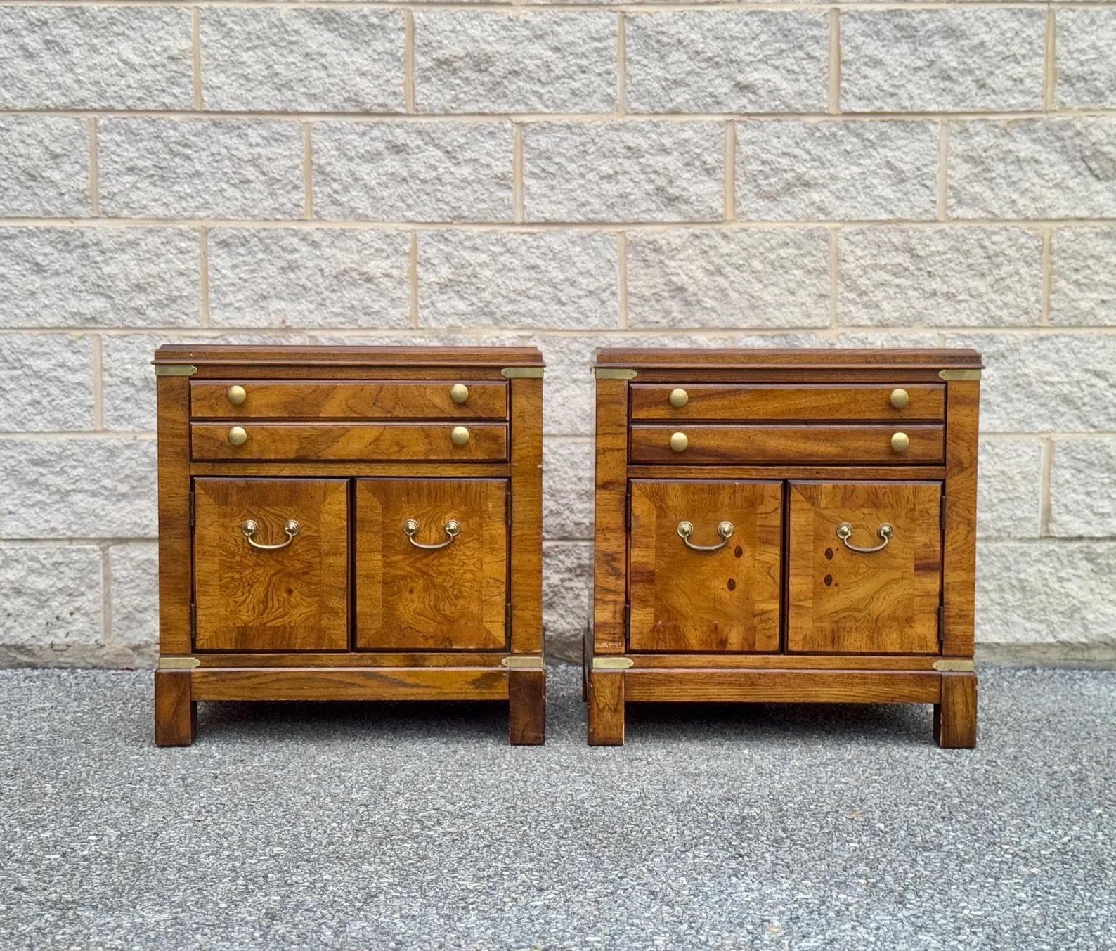 A pair of Lane nightstands featuring a low-profile drawer and a spacious open compartment below, elegantly accented with brass details and crafted from rich burled wood.


