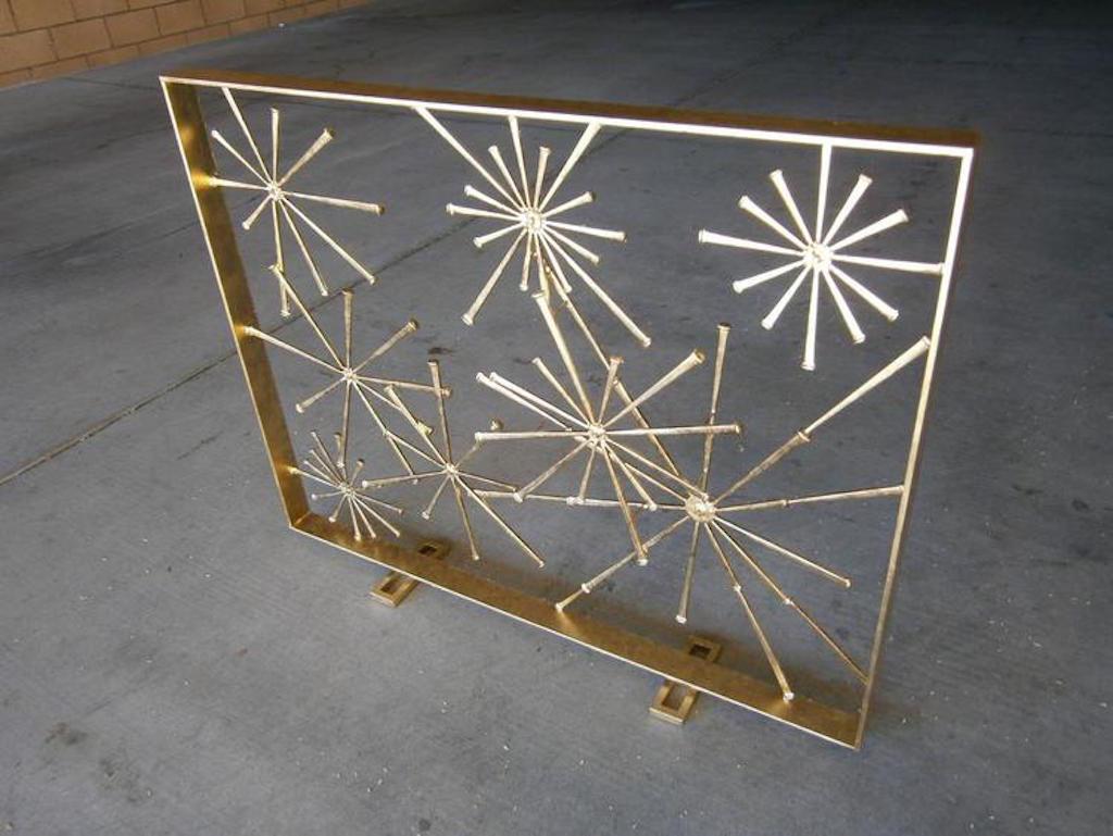 A contemporary gilded metal fire screen, hand-fabricated by American Studio artist Del Williams. The 