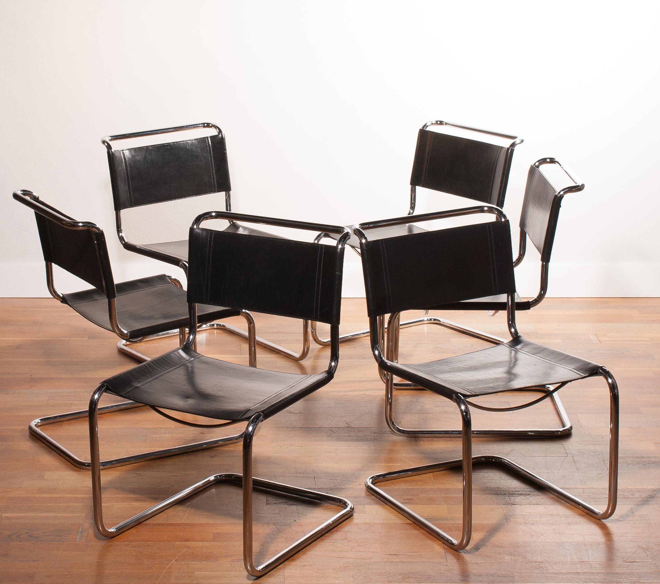 A beautiful set of six dining chairs designed by Mart Stam for Fasem.
These chairs have a cantilevered tubular metal frame with black saddle leather seating and backrest.
They are in wonderful condition.
Period 1970s.
Dimensions: H 84 cm, W 52
