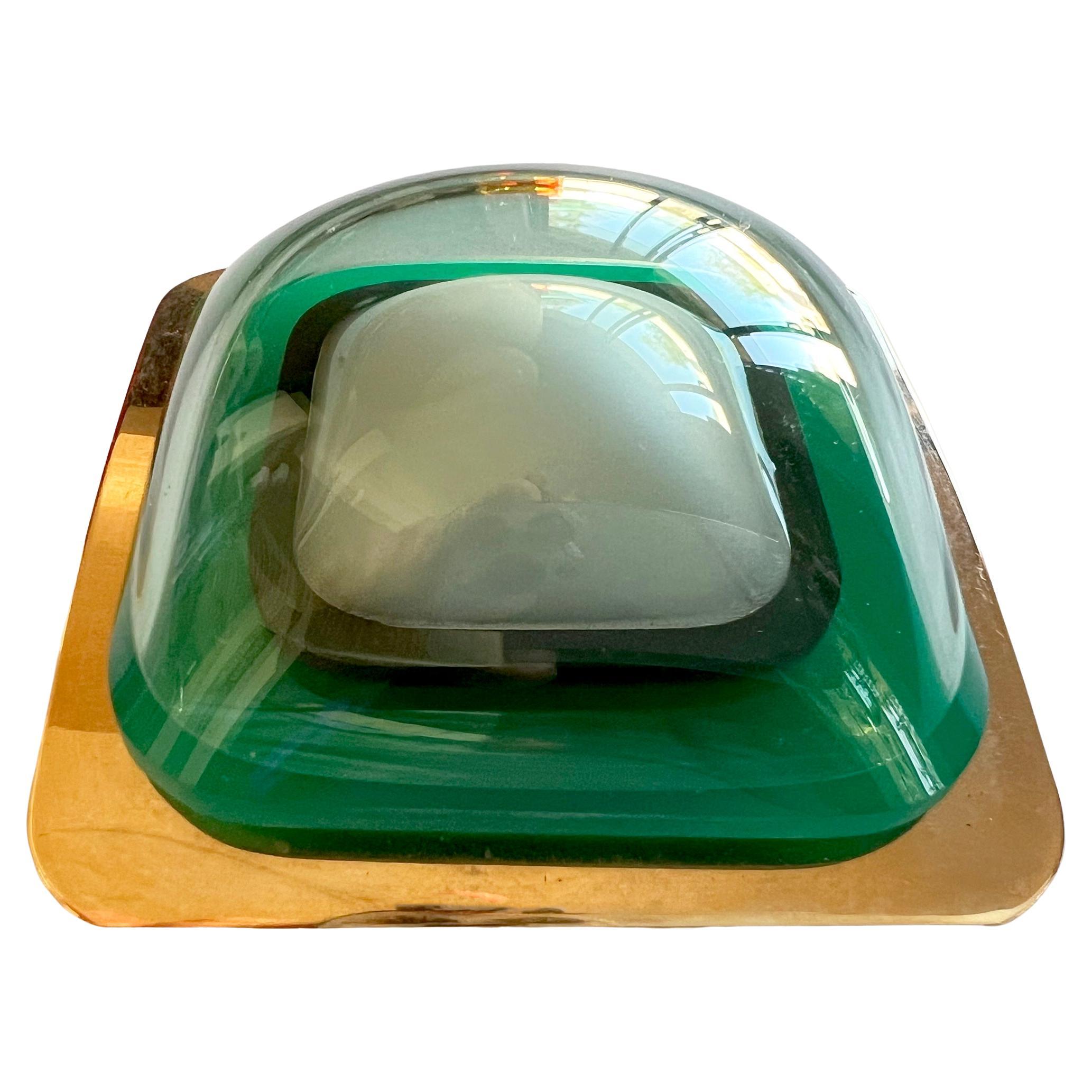 Vacuum-formed mint and emerald green plexiglas belt buckle mounted on plated brass buckle created by artist and sculptor Aaronel deRoy Gruber, circa 1970's.  Buckle measures 2 7/8
