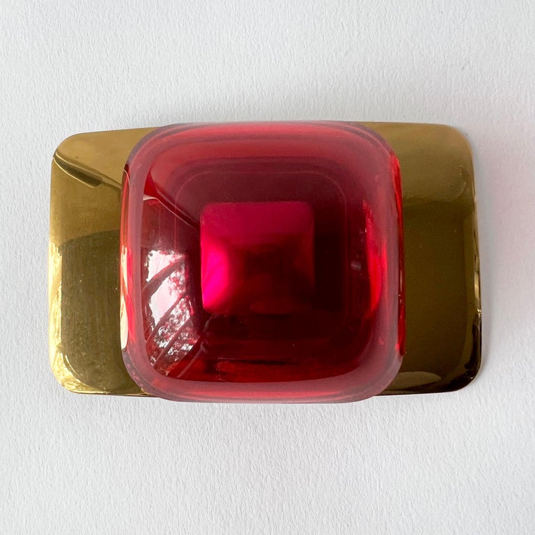 Vacuum-formed red and magenta plexiglas belt buckle mounted on metal plated brass buckle created by artist and sculptor Aaronel deRoy Gruber, circa 1970's.  Buckle measures 2.5