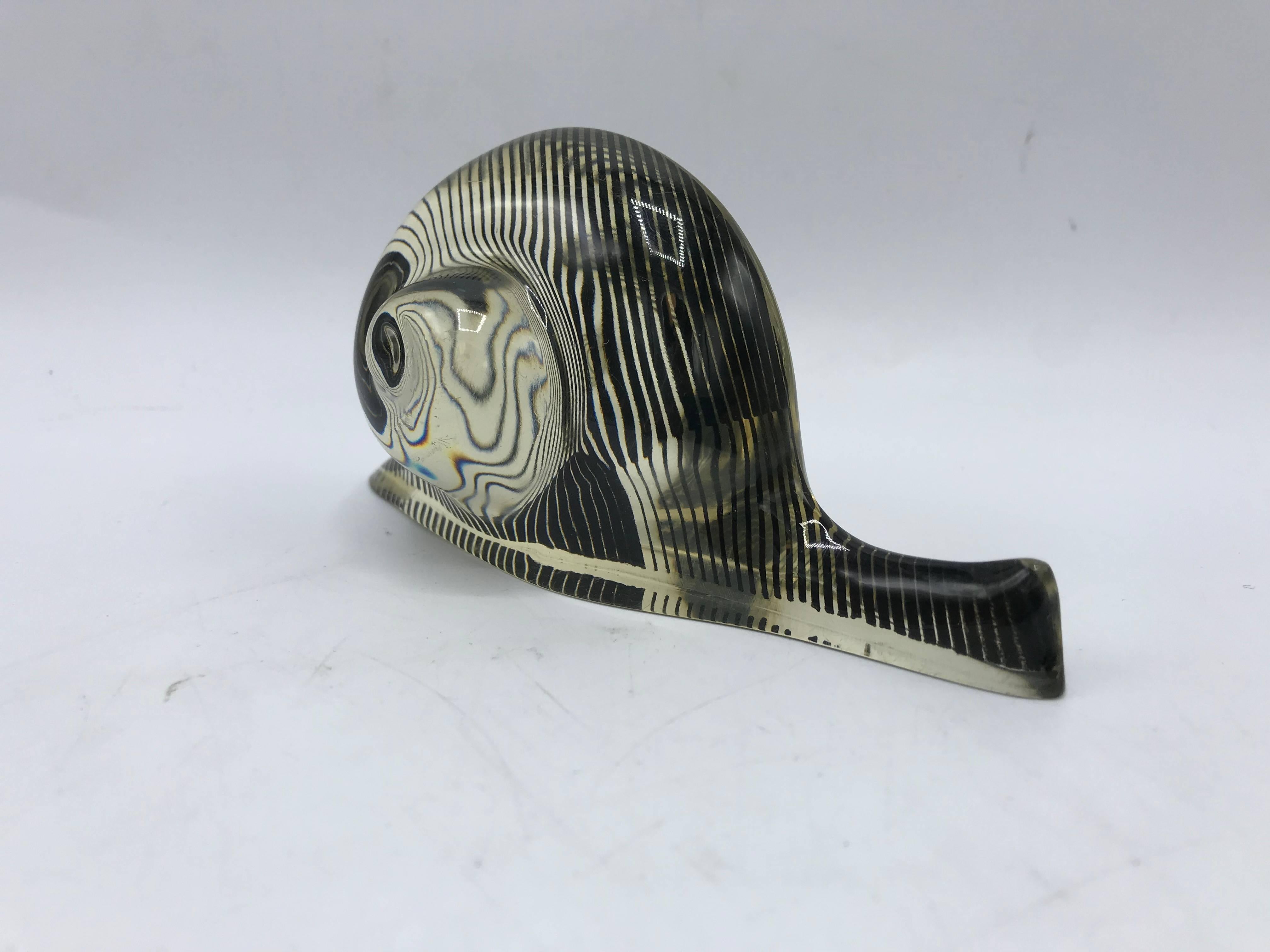 Listed is a fabulous, 1970's Abraham Palatnik lucite hologram snail sculpture. The piece includes original 