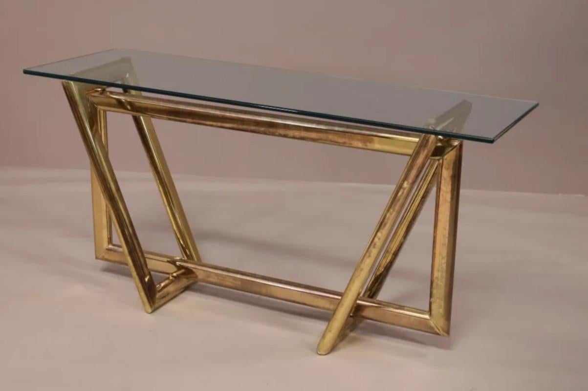 BRASS AND GLASS CONSOLE TABLE IN THE STYLE OF KARL SPRINGER. 54
