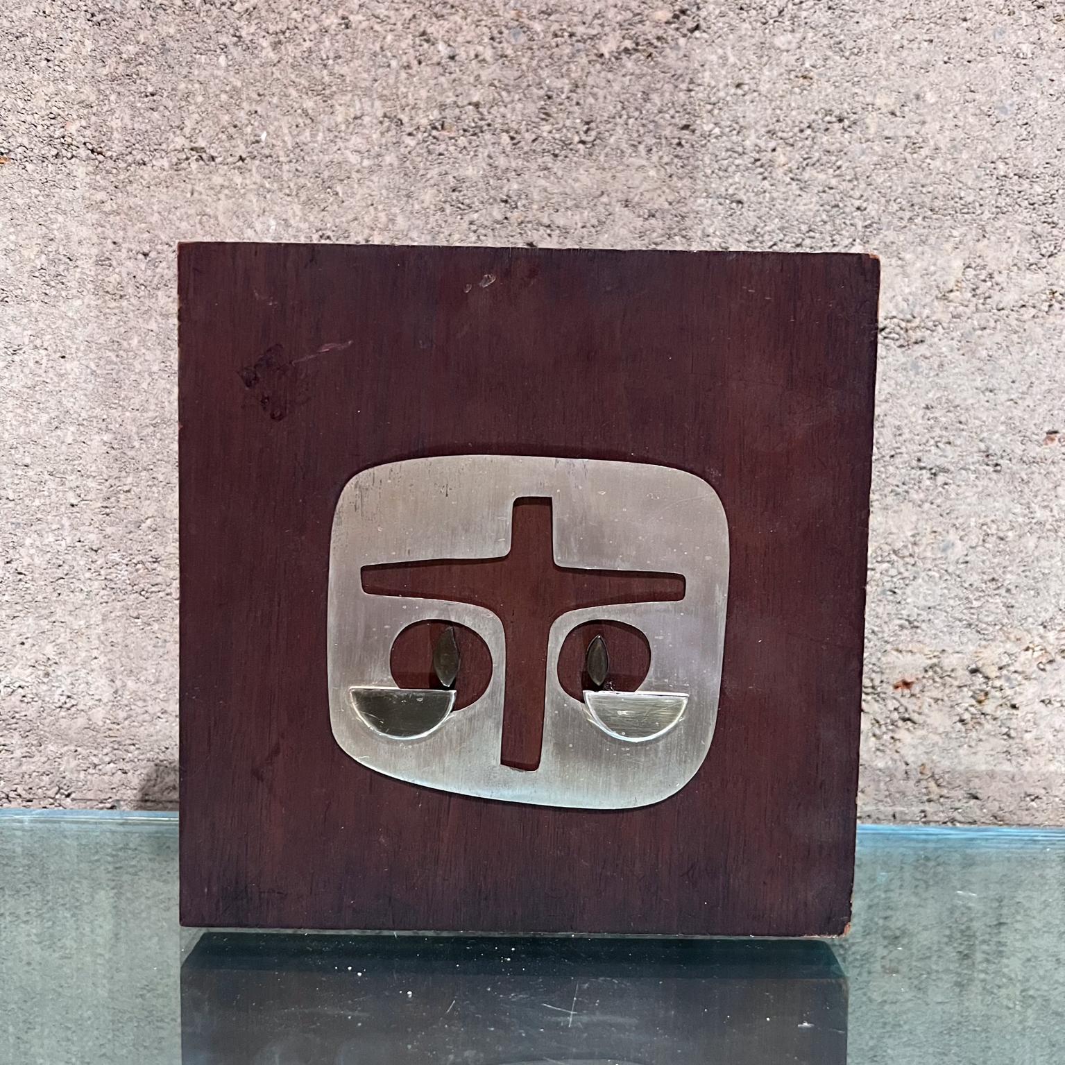 1970s Abstract Wall Art Plaque by Emaus Benedictine Monks of Cuernavaca, Mexico
Maker stamped
8 w x 8 h x 1 d
Handmade solid mahogany wood and Sterling Silver.
Original unrestored vintage preowned condition.
See images please.