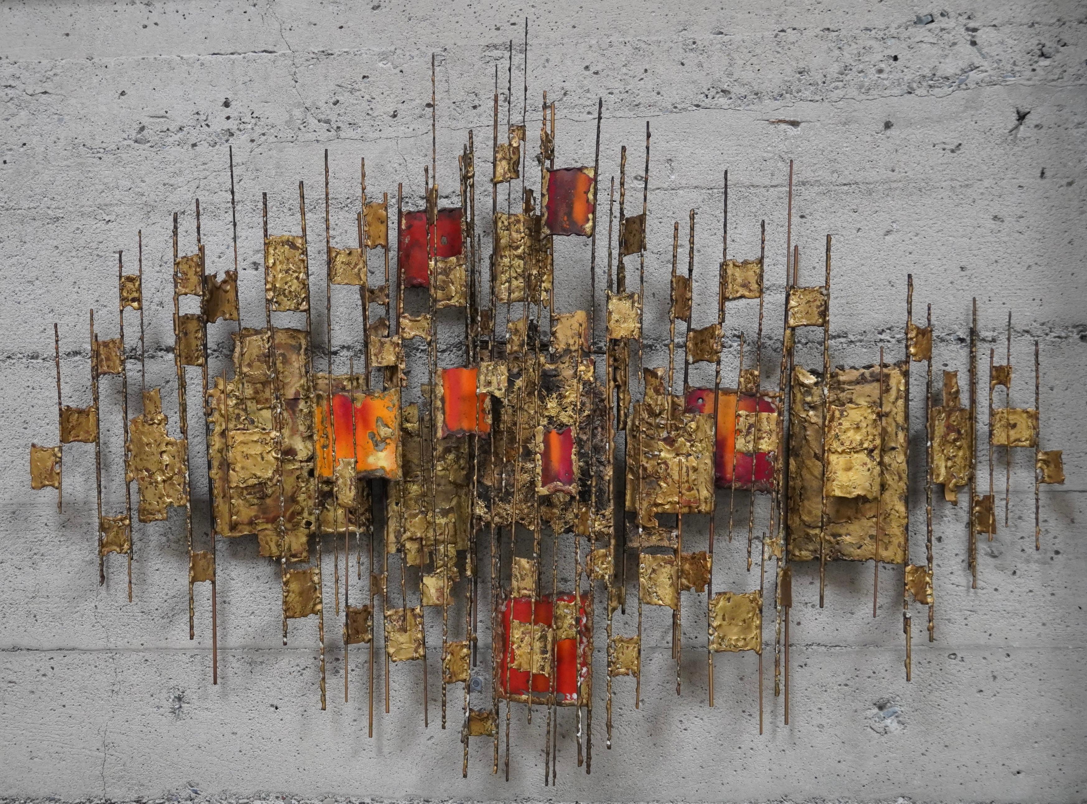 Multi colored enamel abstract wall sculpture in brass by California artist Malcolm Moran. Constructed of various sizes of brass rods and enamel coated brass elements welded throughout the sculpture creating different levels of visual scale and