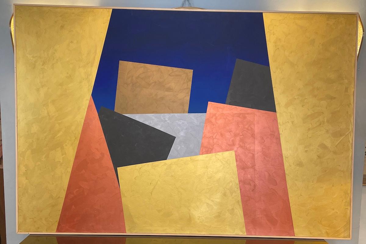 Quadro astratto di Visentin degli anni '70 che raffigura una città. Il dipinto è caratterizzato da motivi cromatici precisi, colorati e intensi, resi ancora più vivaci dalle linee forti e accentuate. Le forme si raddoppiano e si moltiplicano,