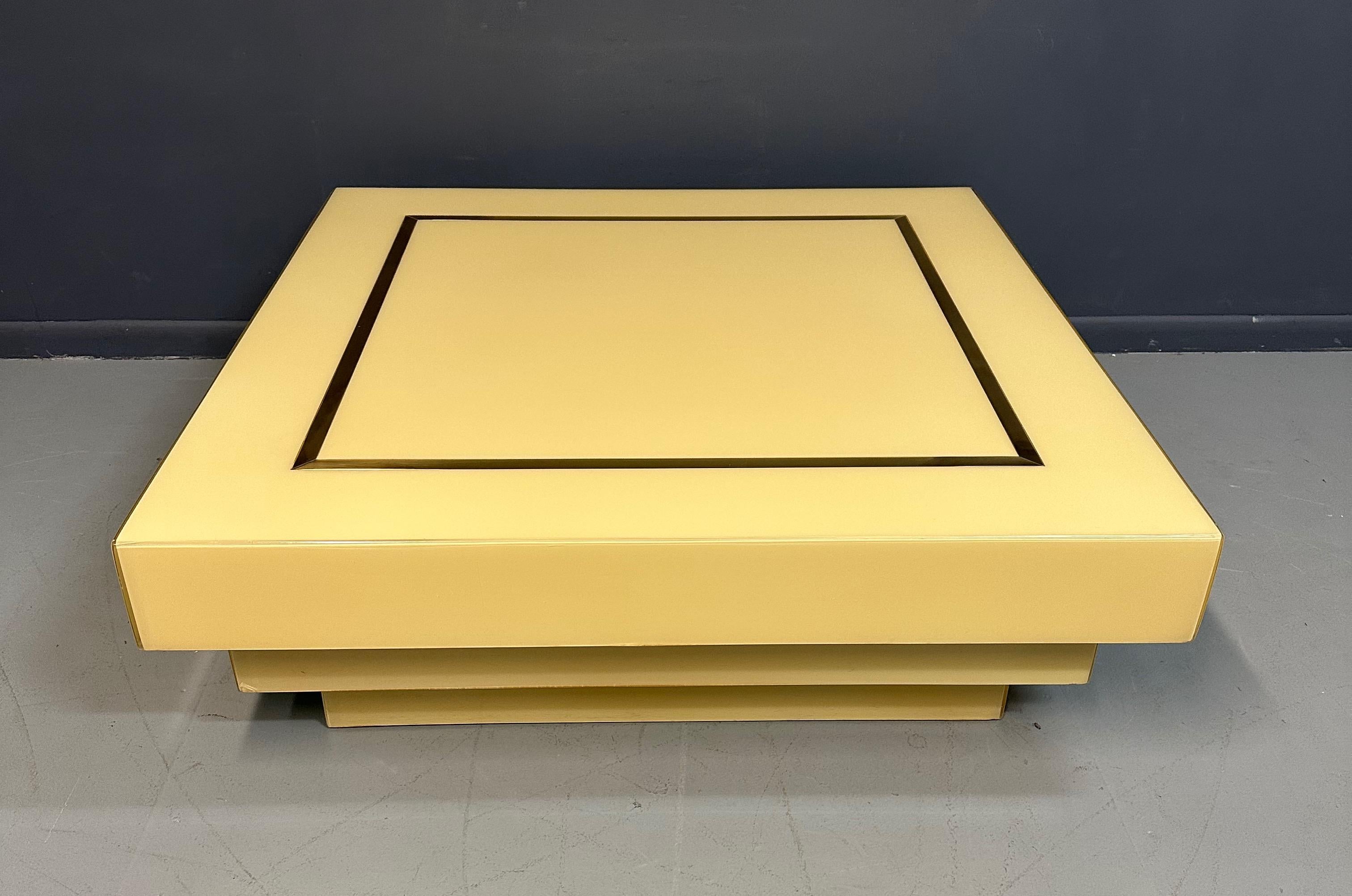 North American 1970s Acrylic Stepped Cream Colored Coffee Table with Brass Ribbon Inlay  For Sale