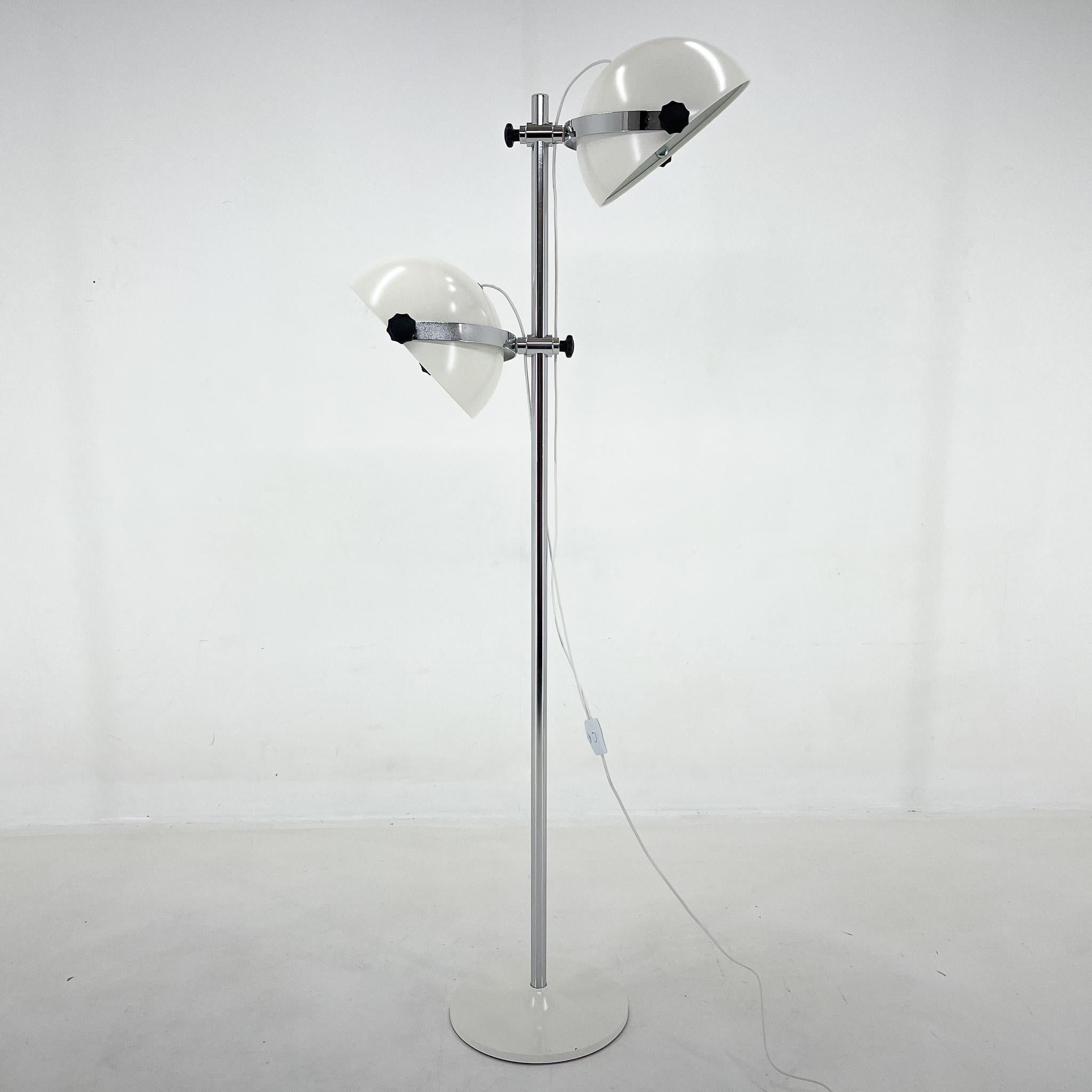 Rare chrome and laquered metal floor lamp, made in Italy in the 1970's. Both lamp shades are adjustable in all directions. The lamp is fully restored and rewired with some signs of use on the chromed parts. The two lights can be lit separatelly.