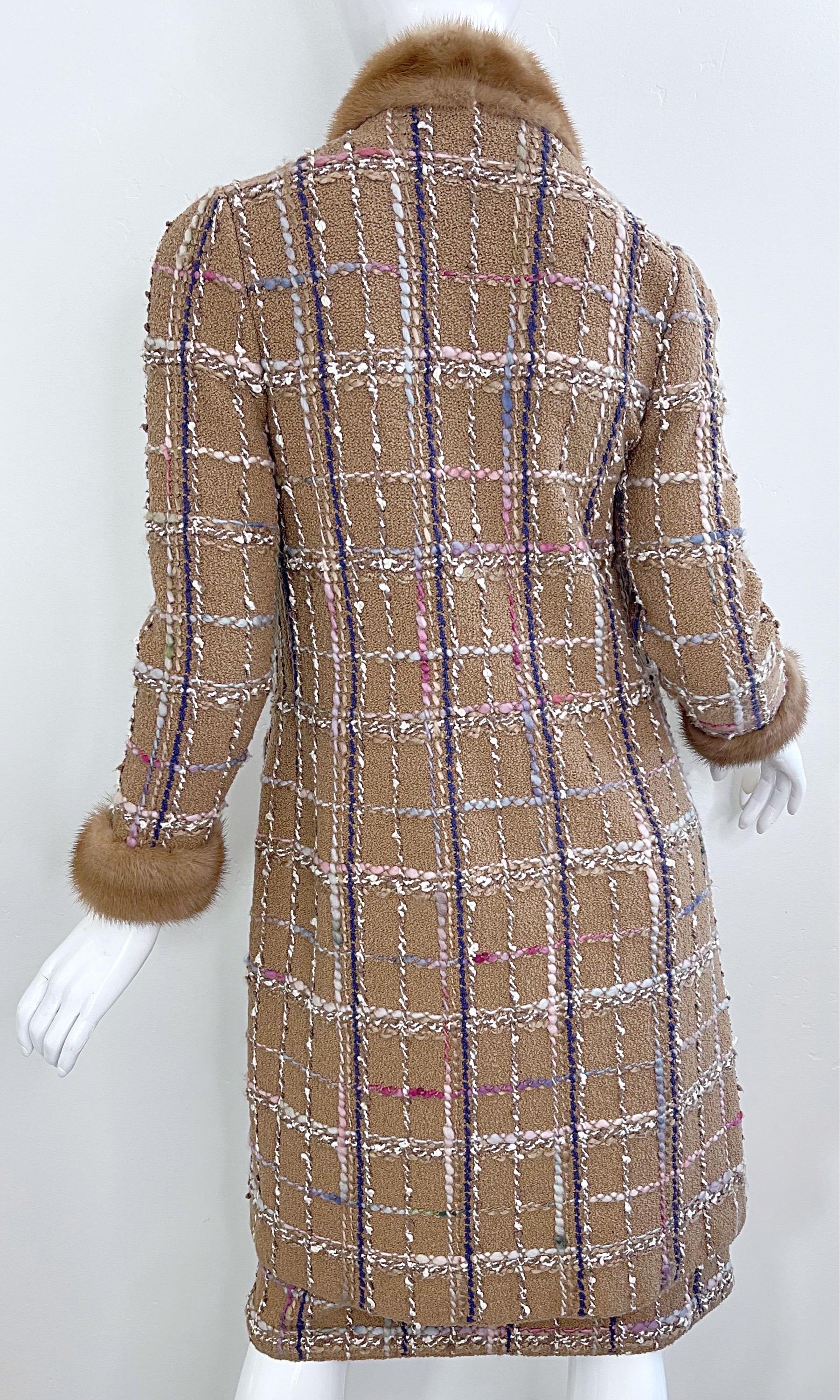 Step into the glamour of 1970s high fashion with this luxurious Adolfo at Saks Fifth Avenue camel wool tweed skirt suit, masterfully tailored with opulent mink fur trim. The rich boucle fabric features a multicolored windowpane plaid in hues of